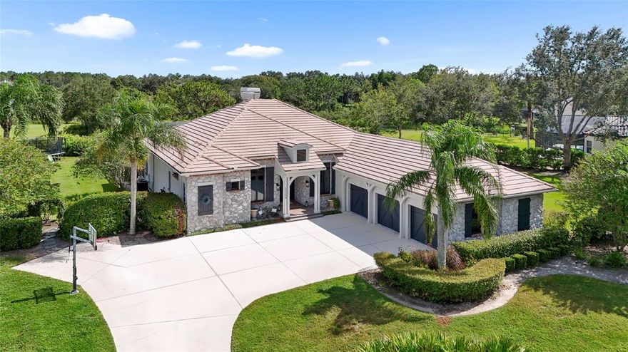 Prepare to be captivated by this custom Arthur Rutenberg home, located in the prestigious Preserve at Panther Ridge. Situated on a private 1.67-acre landscaped, lakefront lot this stunning 3,300+ sqft residence has been COMPLETELY RENOVATED (2023). The versatile floor plan allows for multiple living arrangements and can easily function as five bedrooms plus an office, or four bedrooms with a separate office and bonus room. The bonus room features a vaulted ceiling, window seat, and sliding glass doors that open directly to the pool area—ideal for a guest suite, studio, home gym, or game room. Throughout the home, you’ll find newly refinished hardwood flooring, custom soft-close cabinetry with dovetail drawers, and striking quartz countertops that elevate every space. In the heart of the home, the chef’s kitchen is both stunning and functional, complete with a large center island, farmhouse sink, wine refrigerator, custom range hood, open shelving, and expansive breakfast bar perfect for entertaining. Designer light fixtures, plantation shutters, and elegant ceiling beam accents complement the home’s detailed craftsmanship, while crown molding and shiplap trim provide a warm, custom finish. The living room, kitchen nook, and family room are all connected by architectural details and a two-sided gas fireplace, enhancing both ambiance and flow. Pocketing sliding glass doors in the family room reveal the expansive lanai and peaceful lake views, creating an effortless transition for indoor—outdoor living. The heated pool and spa—complete with an in-pool cleaning system, new pool pump (2021), automated pool control system (2022), and heat pump (2022)—provide a luxurious retreat year-round. The oversized, pavered lanai offers multiple covered seating areas, a generous sun deck space, and includes a mounted TV for outdoor enjoyment. Step into the primary suite through double-glass doors and discover a private haven featuring architectural ceiling beams, warm wood floors, a spacious sitting area with views of the pool, private access to the lanai, and dual walk-in closets. The completely renovated primary bathroom features custom cabinetry, quartz countertops, double sinks, stylish mirrors and lighting, and a large walk-in shower with refined tile finishes. The guest bathrooms have also been refreshed with new vanities, lighting, and glass shower enclosures. Even the laundry room received a full upgrade with new cabinets, countertops, a utility sink, and open shelving for added storage and convenience. Additional updates to the home include full interior and exterior painting (2023), a new deep well and water heater (2022), and a new water softener. The garage features three individual bays and includes a 240-volt electric vehicle outlet (2023). In addition the electrical sub-panel was upgraded (2025), and one of the two HVAC units was replaced for added efficiency and peace of mind (2025). The home also includes several newer windows in select rooms (2023). Panther Ridge offers 15 miles of walking and equestrian trails, a community park with a pavilion, tennis courts, basketball, and a playground. Residents enjoy the serenity of a country-like setting with the convenience of being only a short drive to Lakewood Ranch, top-rated schools, and the area's best shopping, dining, hospitals. With a low HOA and no CDD fees, this extraordinary property offers a rare opportunity to own a luxurious, move-in-ready estate that feels brand new.