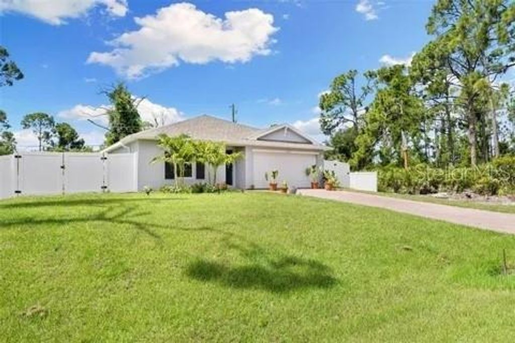 Photo of 13339 Flaherty Avenue, Port Charlotte, FL 33981 (MLS # D6144035)