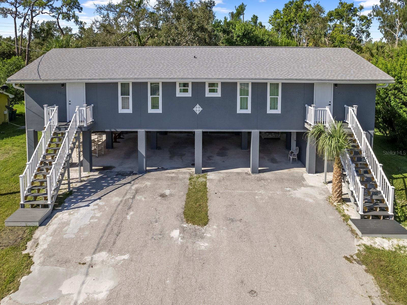 FULLY RENOVATED UNIT in DUPLEX available for Rent! Prime Location in the picturesque neighborhood of Port Charlotte. Situated just a 3-minute walk from the scenic coastline of Bayshore Oak Park and only 3 miles from the famous Fishermen's Village of Punta Gorda, this property offers a perfect blend of serene surroundings and convenient access to local attractions. UNIT features 952 sq ft of modern living space, including 2 spacious bedrooms with balcony access, 2 bathrooms (one with a standing shower), a sleek kitchen with stainless steel appliances and quartz countertops, durable vinyl and tile flooring, a large deck with tranquil views, contemporary finishes, and an in-unit washer and dryer for added convenience. This unit is designed to provide comfort and style, with each detail carefully selected for a modern lifestyle. Workshop/Storage in Parking Area under the Units. 4 Spacious Covered Parking Stalls (Cars or Boats). 10x13 Metal Storage Shed. Space for Outdoor Lounging and Grilling. LOCATION: Short walk to Bayshore Oak Park, where you can enjoy trails, playgrounds, picnic areas, fishing, and boat/kayak access. Port Charlotte and Punta Gorda offer a plethora of shops, dining options, and entertainment. This home is conveniently located to major highways, providing a quick commute to nearby towns and cities, local schools, golf courses, parks, Charlotte Harbor, and beautiful beaches of the Gulf of Mexico.
