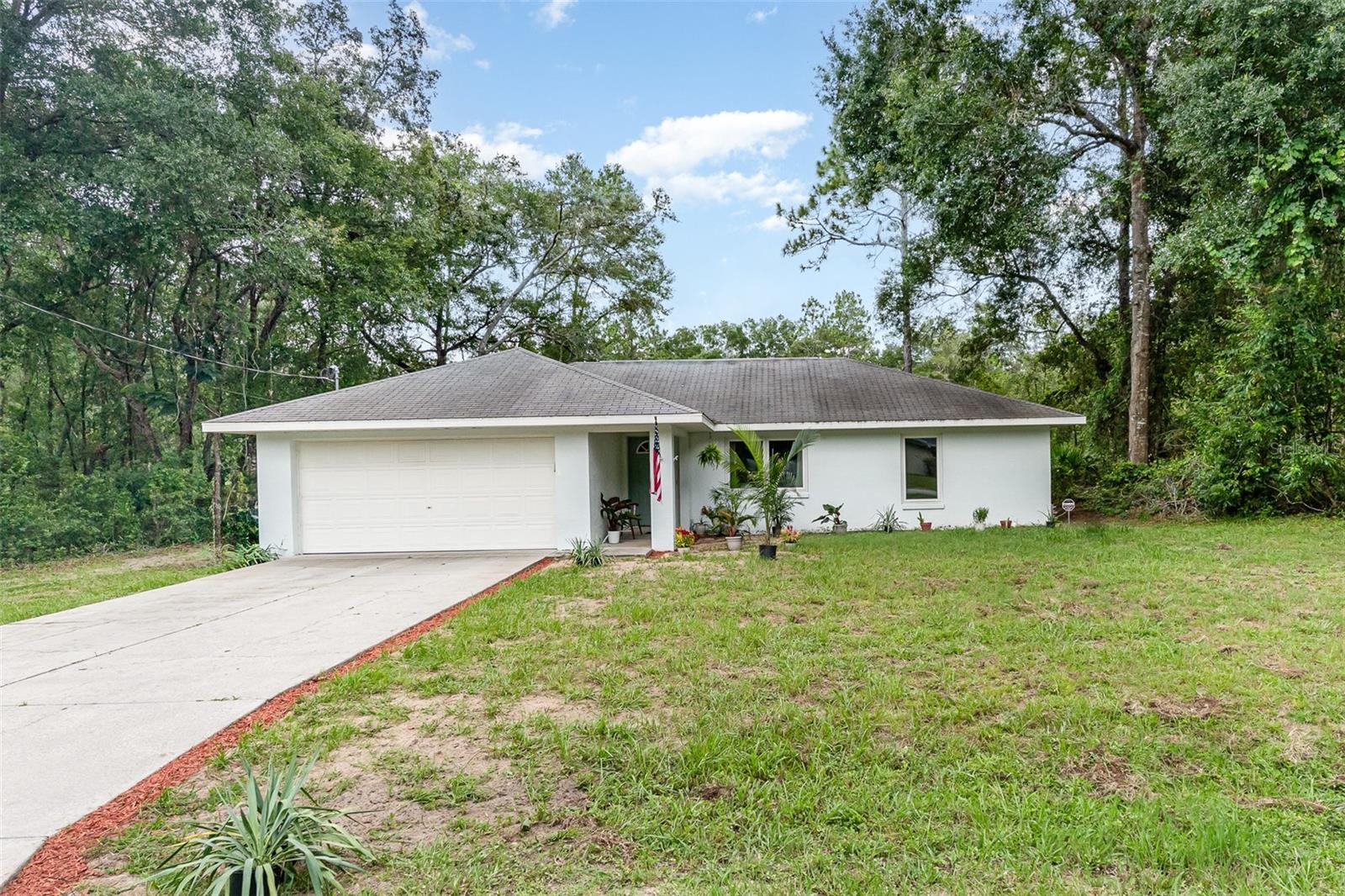 The best of rural living with this charming 3 bedroom/2 full bath SFR in the Inverness Highlands Subdivision. All of the windows in this home have been updated with new hurricane storm windows and a glass French Door installed in 2024. The owner owns the adjacent tract of land also almost a 1/4 acre tract, and is open to selling that with this too. The possibilities are limitless with no HOA or Building restrictions. Privacy surrounds you. Home has 2 car garage. Vaulted Ceiling w/ fans.