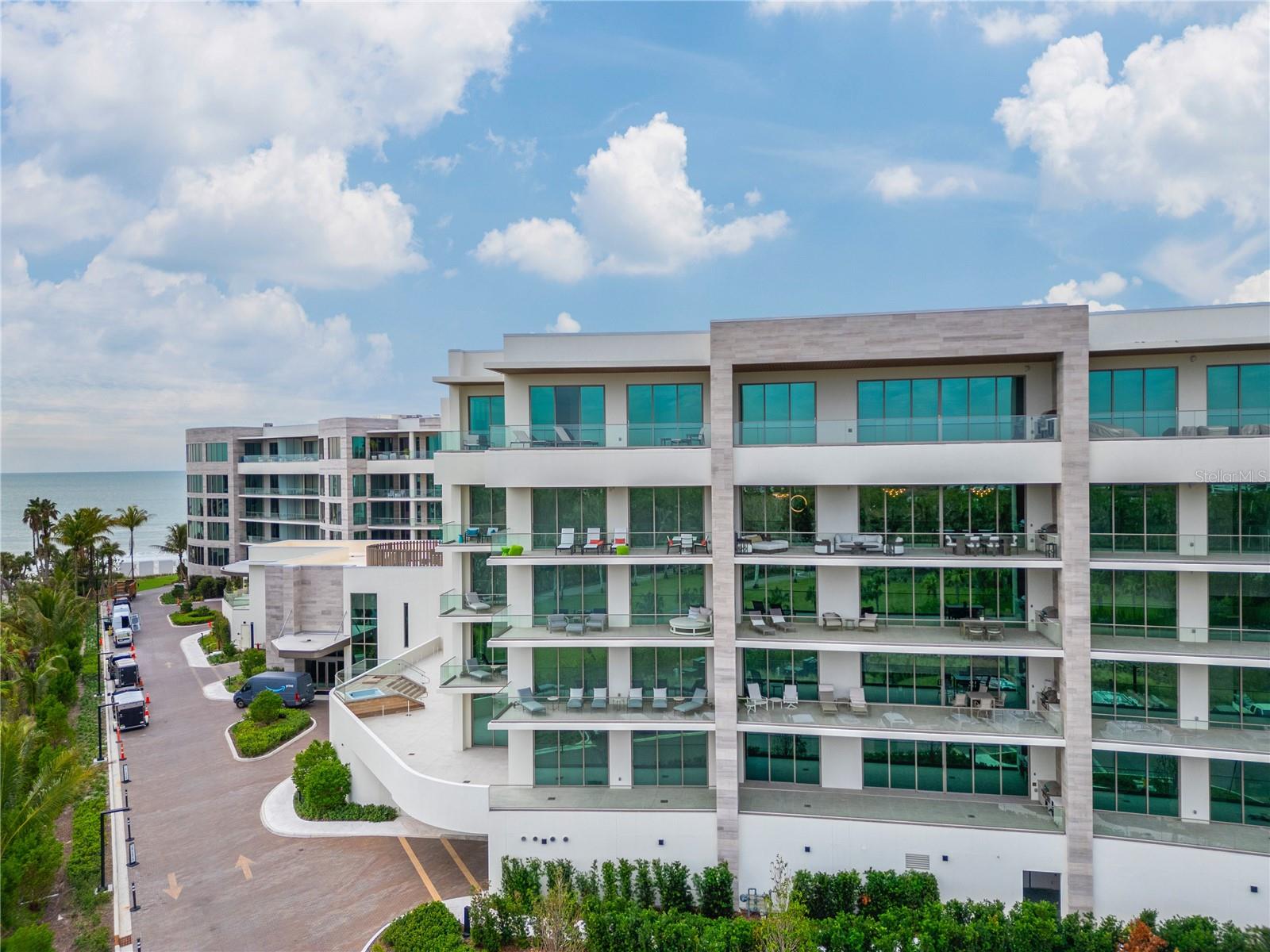 Enter the unit from a private elevator which features a spacious, open-plan living area with large windows allowing natural light and incredible views of the surrounding landscape and Sarasota Bay. The lavish living space opens up onto a stunning balcony that overlooks Sarasota Bay and the St. Regis grounds and includes a gas grill. The stylish living area includes high-end furniture with a modern, chic design, featuring plush seating, rich textures, and sophisticated décor. The gourmet kitchen is fully equipped with top-of-the-line stone countertops, custom cabinetry, and state-of-the-art appliances. The elegant bedroom includes a king-sized bed with luxurious linens, soft lighting, and unique, custom-made furniture. 2 modern bathrooms- one half bathroom for guests and a full bathroom off of the master bedroom that includes high-end finishes, a freestanding soaking tub, a spacious walk-in shower, double vanities, and a calming color palette. The unit also offers a sound system, parking in the private garage and full laundry room.
The Resort has plenty of amenities for everyone to enjoy. Enjoy first class dining, an underwater sea lagoon or a lazy river float after drinks at the Monkey Bar. The Resort also offers a spa, coffee shops, butler service, event planning, fitness center, private cabanas and much, much more.