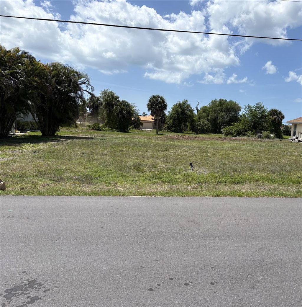Photo of 263 White Marsh Lane, Rotonda West, FL 33947 (MLS # D6143185)