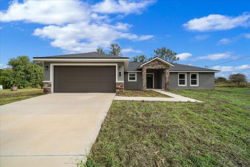 Photo of 3 Malauka Radial Track, Ocklawaha, FL 32179 (MLS # OM707454)