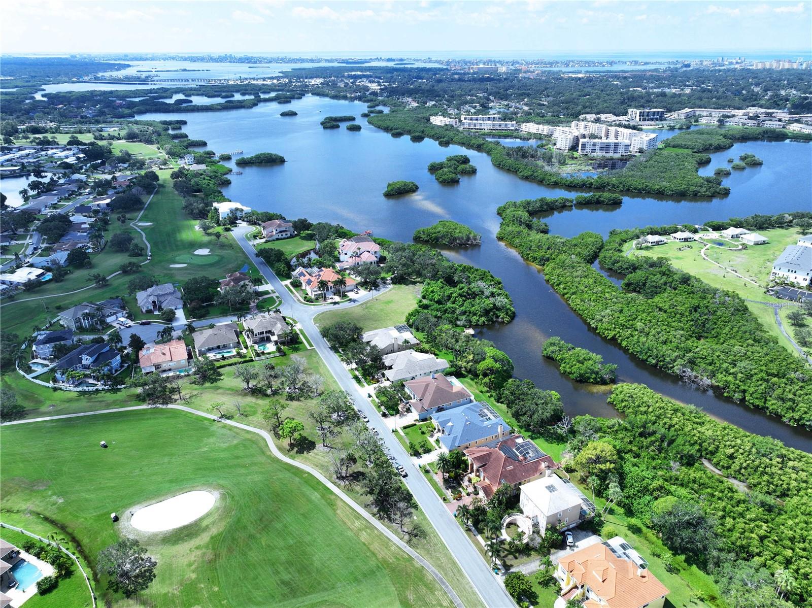 One or more photo(s) has been virtually staged. Exceptional Waterfront Living in Long Bayou Estates-
Discover a rare opportunity in one of Seminole’s most coveted communities. This expansive 5-bedroom residence offers panoramic golf course views and direct waterfront access to the bayou leading to Boca Ciega Bay-an ideal setting for boating enthusiasts and nature lovers alike.
Designed for flexibility, the home features two primary suites and a thoughtfully arranged layout. One wing includes two bedrooms with a shared full bath, while the fifth bedroom-perfect as a nursery or executive office adjoins the main suite. The second primary suite, complete with a fireplace, offers a private retreat for multigenerational living or entertainment.
Recent upgrades include a newer roof, HVAC system, and fresh exterior paint, ensuring long-term peace of mind. Inside, enjoy soaring ceilings, tray accents, French doors, formal living and dining spaces, and a spacious laundry room. The kitchen provides ample room to create a custom culinary experience tailored to your lifestyle.
Located minutes from Lake Seminole Park, Seminole Lake Country Club, and the vibrant Seminole City Center, this home blends tranquility with convenience. With no CDD, low HOA fee, and available architectural plans to unlock its full potential, this property is ideal for discerning buyers or savvy investors seeking luxury, location, and lifestyle.