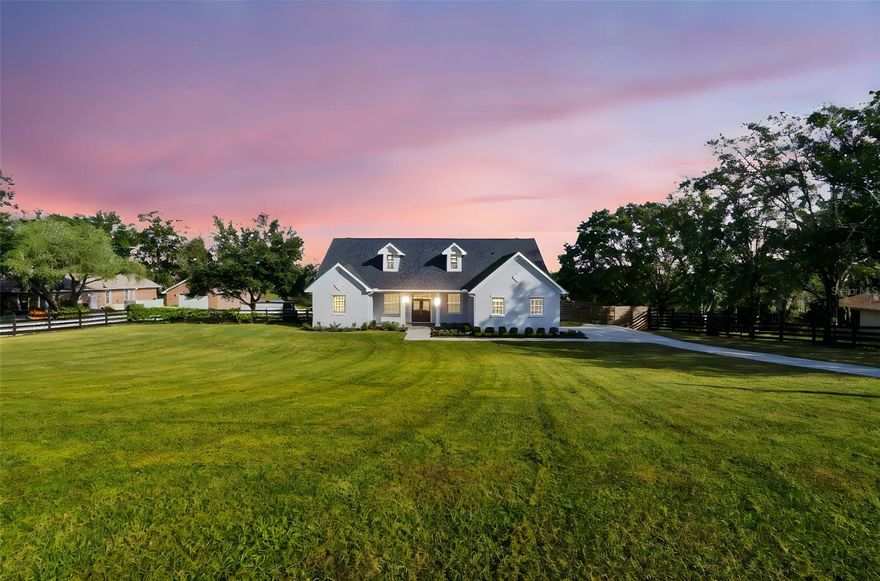 Escape to peaceful country living in this beautiful retreat nestled in the rolling hills of Dade City! This well-maintained 3-bedroom, 2-bath pool home sits on 1.33 acres, offering the perfect blend of privacy, comfort, and scenic country charm. The open floor plan is filled with natural light and flows seamlessly to the screened-in pool and spa—ideal for relaxing afternoons or entertaining family and friends. The primary suite features his-and-hers closets and elegant French doors that open to the tranquil patio. The spacious kitchen offers ample counter space, and the separate dining room can easily serve as an office or cozy sitting area. A separate den provides plenty of room for guests or additional living space. Enjoy stunning sunsets from the patio or unwind in the hot tub while surrounded by beautiful landscaping. The property is fully fenced with a large privacy wall in the front yard for added seclusion. Recent upgrades include a new roof (2025) and like-new Samsung appliances, including a washer and dryer. With low HOA fees, generous storage, and convenient access to I-75 for quick trips to Tampa, shopping, dining, and the airport, this home perfectly combines country tranquility with city convenience.