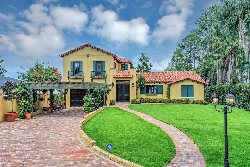 Discover this exquisite lakefront property nestled on over 1.9 acres with more than 100 feet of water frontage on LAKE TIBET and part of the Butler Chain of Lakes. This home offers breathtaking views and absolutely stunning sunsets.   As you drive onto the winding paver circular driveway with lovely fountain and beautiful landscaping, you will notice the terracotta tile roof and the undeniable architectural style of this home. The 2 car garage has EV charging station. Once you enter the home you will be impressed with the whole house automation system, motorized window treatments, travertine floors, gas fireplace and crown moulding.  At the heart of the home, the chef’s kitchen featuring elegant custom cabinetry, boasts of a large island, granite counter , 2 Sub Zero appliances, reverse osmosis system, pot filler, Wolf steamer, warming drawer and wine fridge.  Downstairs are 2 additional bedrooms with en-suites each with special features.  Upstairs, You will admire the solid hardwood flooring and attention to details.  Primary suite overlooks the breath taking view of Lake Tibet  and features en-suite adorned with stone flooring with stand alone tub and separate shower. The primary suite has a large walk-in closet with a custom built closet system w/safe and another separate closet. Two additional bedrooms upstairs share a full bath. 
A sparkling pool w/spa within the screened patio offers a tropical escape with a summer kitchen featuring, large grill, hotplate, warming tray, pot filler and  TV and misting station.  The  secondary covered patio outside the screened enclosure is perfect for an additional quiet oasis to enjoy your stunning views. The newly re-built dock and covered boat house w/lift (2023) with composite decking comes complete with electric & water is perfect for the enjoyable days and nights on the water.  Other features include updated septic system(2024), new pool pump (2025), H2O Water Softener system, No Home Owner Association.  Seller is leaving all electronics within the home. Conveniently located minutes from “Restaurant Row”, Disneys Springs, Bay Hill and zoned for “Top Rated” Schools.  Schedule private tour of this remarkable home today.