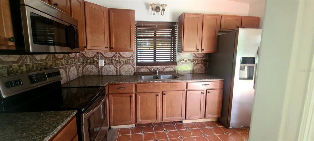 Photo of 301 Hope Circle, Orlando, FL 32811 (MLS # O6421280)