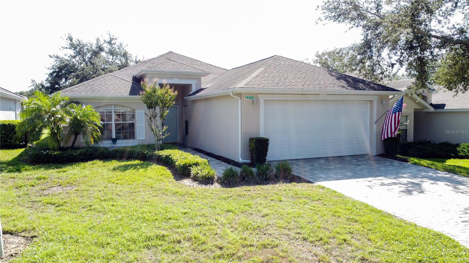 A Must See! One of the few Colonial Homes in gated 55+ Kings Ridge community. Move in Ready! It is a Royal Sydney model located on the championship golf course. It is a very open floor plan with 1554 SF, with 2 BD/2 BA and a Den plus an oversized 2 car garage. The paver brick driveway adds great curb appeal. New roof in Oct 2014 and a Carrier AC unit was installed in Oct 2013. The entire interior of the home just been repainted. There is laminate flooring throughout all the main areas and carpet in bedrooms & den. The kitchen has recessed lighting, a new Farmer sink, new disposal and a new Refrigerator. The laundry room has new upper cabinetry plus a brand new washer & dryer that will remain. The primary bedroom closet has been remodeled by Closets by Design. the primary bathroom has a walk in shower and a private toilet area. The back lanai has covered and open areas and the patio furniture & heater only will remain. The garage is a double size with tandem parking for a golf cart. Brand new cabinetry installed in the garage for storage. The Freezer in the garage will also remain. The Seller has put on a full 1 year Old Republic Home Warranty for the new Buyer. Kings Ridge is a 55 Plus gated golf community located in the rolling hills of Clermont, FL. Enjoy the Royal life style in the multi-million $ clubhouse with 3 heated pools, spas, tennis & pickle ball courts, billiards, shuffle board, shows, Bingo, cards and clubs galore. The monthly maintenance fees include: lawn maintenance including trimming of shrubs, care of irrigation system & irrigation water, internet, TV & home phone thru FiberNow, maintenance of roads and outside painting of home every 7 years. Take your golf cart to the Kings Ridge Plaza where you can do your grocery shopping, banking or dine out. Approximately 30 minutes to Disney Parks or Universal Studios.