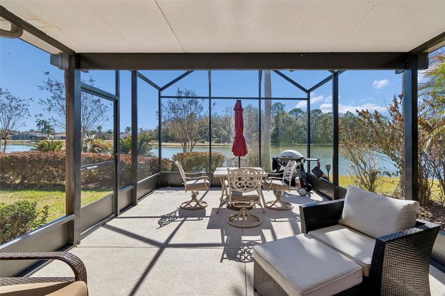 Gorgeous WATERFRONT Carnegie model with SUNROOM addition and OPEN-AIR covered and screened lanai where you can take in STUNNING VIEWS of both water and conservation, creating the ideal PRIVATE LOT. NEW ROOF COMING SOON! Step into this beautiful home featuring CERAMIC TILE laid on the diagonal in the living room and CROWN MOLDING throughout. The kitchen showcases 42-inch cabinetry with glass fronts, convenient DRAWER STORAGE, EXTENDED CABINETRY for additional space, built in WINE RACK, DECORATIVE HOOD above the microwave for an elegant touch, tumbled stone backsplash, and CORIAN counters. Photovoltaic SOLAR PANEL system installed in 2020 provides energy savings for the new owner with a transferable lease ($78 a month), allowing the buyer to benefit from reduced utility costs from day one!! Enjoy outdoor living on the 24 x 13 SCREENED, covered, and EXTENDED lanai ADDED in 2020, with beautiful views and complete privacy—no homes directly behind, just nature and open-air tranquility in a peaceful setting. The spacious PRIMARY SUITE occupies its own private side of the home and boasts a TRAY CEILING, engineered hardwood floors, linen closet, TWO WALK IN CLOSETS, and FRENCH DOOR access to the sunroom. The attached ENSUITE BATHROOM features a soaking tub, separate WALK-IN SHOWER, split vanities with DUAL SINKS, and a private commode. The TILED SUNROOM provides additional living space and is perfect for entertaining while still enjoying the gorgeous water and conservation views. The family room features double-door entry, LAMINATE FLOORS, and PLANTATION SHUTTERS, and is currently being used as a third bedroom option. In addition, the second bedroom is located just off the kitchen and includes an adjacent full bath, making it ideal for guests. THE HVAC was REPLACED in 2023 and the EXTERIOR of the home was painted in OCTOBER of 2025. Separate laundry room with additional storage cabinets, closet pantry and WASHER AND DRYER which are included in sale. Don’t miss your chance to experience the lifestyle you deserve — schedule your private showing today! The HOA: - maintains the LANDSCAPING & IRRIGATION systems in the common areas as well as at individual homesites - maintains the roads throughout the community - PROVIDES SECURITY with gate guards and mobile patrols including the Polk County Sheriff - allows AUTOMATED GATE ACCESS for residents via license plate readers - provides residents with Fiber Optic Internet & TV service.***Poinciana Lakes Plaza is a MAJOR NEW SHOPPING CENTER directly across from the Solivita Main Gate. It features Sprouts Grocery, TJ MAXX, Ross, Burlington, Rack Room Shoes, 5 Below, Ulta, Outback, First Watch, 5 Guys, Panda Express, Bojangles, Jersey Mike's Subs, 5 Guys, Papa John's Pizza, Burrito Bar, Cold Stone Creamery, Urgent Care, Dentist, Hand & Stone Massage, America's Best Eyeglasses, Crunch Fitness, Hair Cuttery, Petco, TD Bank, Verizon Mobile, PLUS MORE TO COME.***