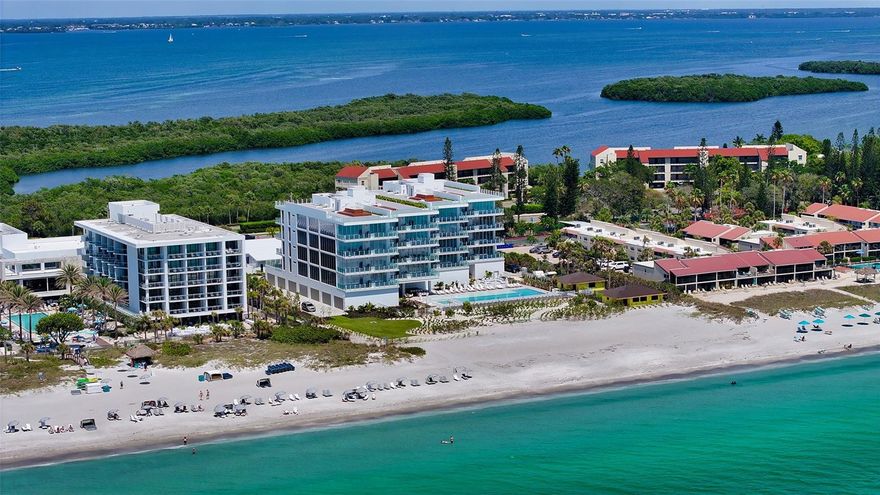 One or more photo(s) has been virtually staged. Welcome to Sage, Longboat Key’s newest boutique ultra-luxury condominium community. Only 16 beachfront residences with unobstructed views of the Gulf of Mexico and Sarasota Bay! Residence number 303 is ready for immediate occupancy offering high-end features such as a spacious great room with an open floor plan, wood floors and soaring 11-foot ceilings. Combination quartz and marble countertops. Custom Italian cabinetry, top-of-the-line (Wolf and Sub-Zero) appliances, 8-foot Italian doors. The condominium is pre-wired for smart-home technology. Floor-to-ceiling sliders and windows bring an abundance of natural light to the residence. A large media room with a wet bar and wine cooler. Awesome summer kitchen on the Gulf-side terrace for family cookouts. 24/7 concierge/security service is always on call. This condominium has everything the most discriminating could expect. The owner’s suite, overlooking the Gulf comes with a spa-like bath featuring a beautiful stand-alone tub with Waterworks fixtures. The two large guest rooms with en-suite baths overlook Sarasota Bay in the split floor plan. Private, and large 2-car garage. Amenities include a Gulf-front heated Olympic swimming pool with a large kid-friendly wet deck. There will be a full-time attendant on duty for both the pool and the beach. A wellness center featuring state-of-the-art fitness equipment, and a yoga lawn. Sage Longboat Key with its modern aesthetic and function creates the ultimate residential luxury!