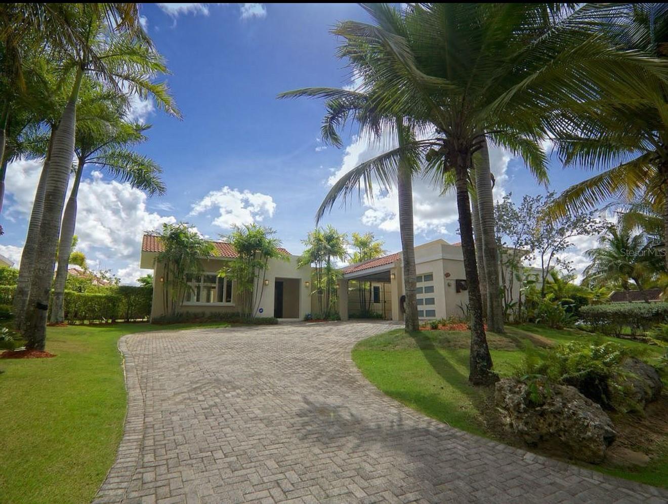 Welcome to a rare opportunity to own a turn-key, fully renovated residence in Dorado Beach East — one of Puerto Rico’s most exclusive and sought-after communities.
This elegant home, freshly renovated in 2025, offers 3,450 sq. ft. of refined living space set on a beautifully landscaped 1,259 sq. m. lot, blending contemporary design with the natural beauty of the Caribbean.
Step inside to discover 4 expansive bedrooms and 5.5 spa-inspired bathrooms, each crafted for comfort, privacy, and style. With an open floor plan that seamlessly connects the living, dining, and entertainment areas, this residence is ideal for both intimate gatherings and grand occasions.
Designed with modern smart-home features, the property includes Thermador and Wolf appliances, intelligent lighting systems, and a state-of-the-art Pentair salt pool system with heated spa and full lighting control. Outdoors, enjoy your own private swimming pool, lush gardens, and serene spaces perfect for soaking up the Puerto Rican sun.
Sustainability meets luxury with Tesla Powerwalls and solar panels, making the home completely self-sufficient with a net energy bill of $0. A backup generator and water cistern add to the peace of mind for year-round living.
As part of the Dorado Beach East community, you’ll enjoy access to world-class amenities, pristine beaches, championship golf courses, fine dining, and the exclusive Ritz-Carlton Reserve lifestyle.
This is more than a home — it’s a statement of modern luxury, sustainability, and elegance in one of the Caribbean’s most coveted addresses.