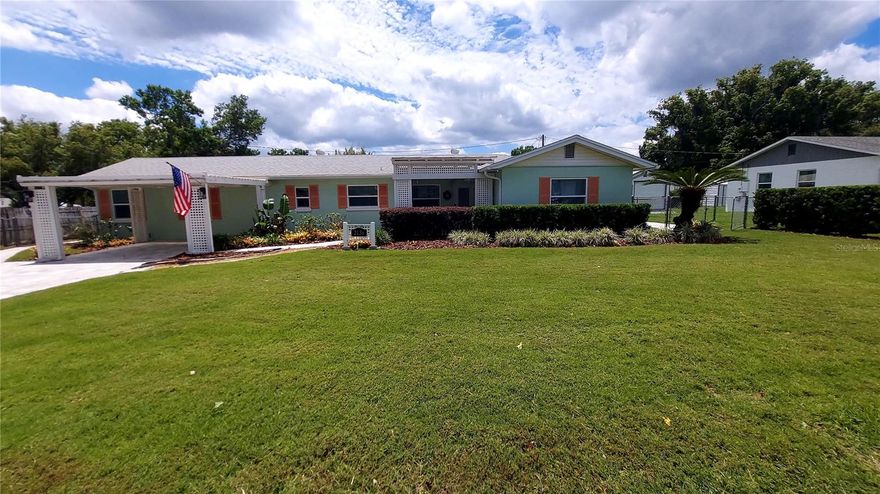 Immaculately Renovated 4 Bd, 2 Bth, 3 Covered Patios, Hot tub, Covered Carport, plus free-standing Exercise Studio/workshop/man cave. Stainless appliances, roof and A/C approximately 5 years old. New Generac Generator w/natural gas line. In-line gas water heater. Luxury Vinyl Floors throughout. Newer windows & doors with Custom Moldings. Numerous LED recessed can lighting & 8 ceiling fans. Dry Bar with upper lit glass cabinetry. All "self-close" kitchen cabinet doors & drawers, with recessed lighting and some drawers with lighting, Quartz Countertops. New 200 amp electrical panel.  Sprinkler System. Large 20' x 12' covered rear patio off of the dining area, with Trex decking. Covered Hot tub & sitting area off of Primary Bedroom. BONUS: Additional Structure 10'x20' Exercise Room/Workshop/man cave with A/C mini-split. Driveway and walkways have beautiful professionally laid pavers (see photos). Convenient to downtown, shopping & restaurants.  Enjoy the beautiful walking path around Lake Gertrude - only a couple blocks from Sylvan Point Dr.  Great Cottage curb appeal.  Show with confidence.  TOTAL move-in condition on a low traffic street.