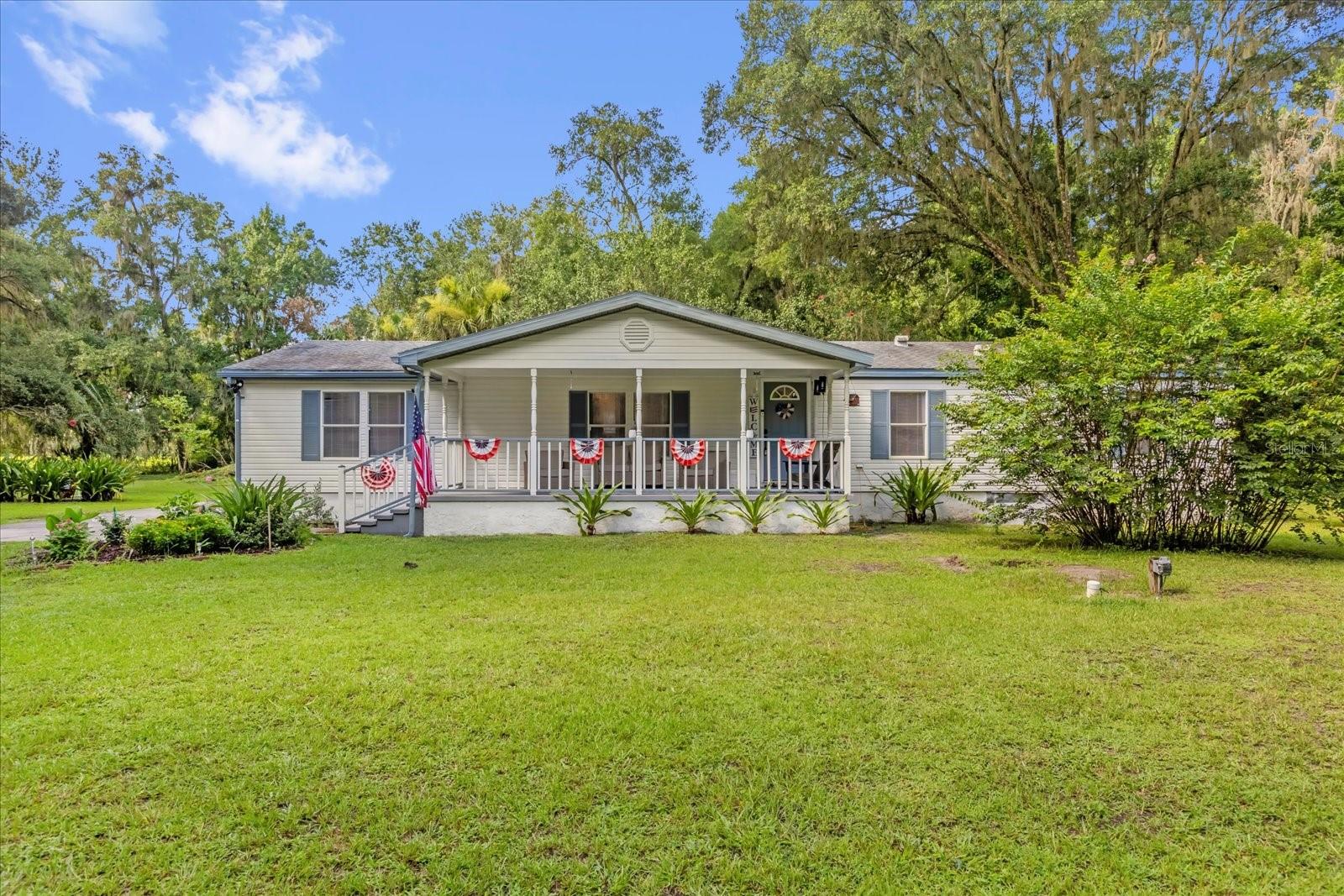 Welcome to peace. This 2-acre property in Reddick, FL offers a blend of modern upgrades and serene countryside living. The remodeled double-wide mobile home boasts a spacious 4-bedroom, 2-bathroom layout, ideal for a family or those needing extra room.
Inside, the home features updated finishes, including new flooring, fresh paint, and modern fixtures throughout. The open-plan kitchen and living area provide a welcoming atmosphere for both daily living and entertaining. The four bedrooms have generous space, and the two bathrooms have been fully remodeled for a fresh, functional feel.
The property includes a well-maintained septic system with new pumps, ensuring smooth operation for years to come. Outside, you'll find a variety of fruit trees, adding both beauty and a potential harvest of fresh produce—perfect for those who appreciate homegrown fruits.
A large storage building offers additional space for tools, equipment, or hobbies, while a sturdy gate provides privacy and security for the entire property.
This peaceful, rural location combines the best of modern living with the tranquility of Florida's countryside, making it a great place to call home or retreat to.
