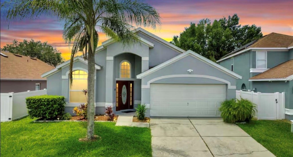 Photo of 522 Rochester Loop, Davenport, FL 33897 (MLS # O6438117)