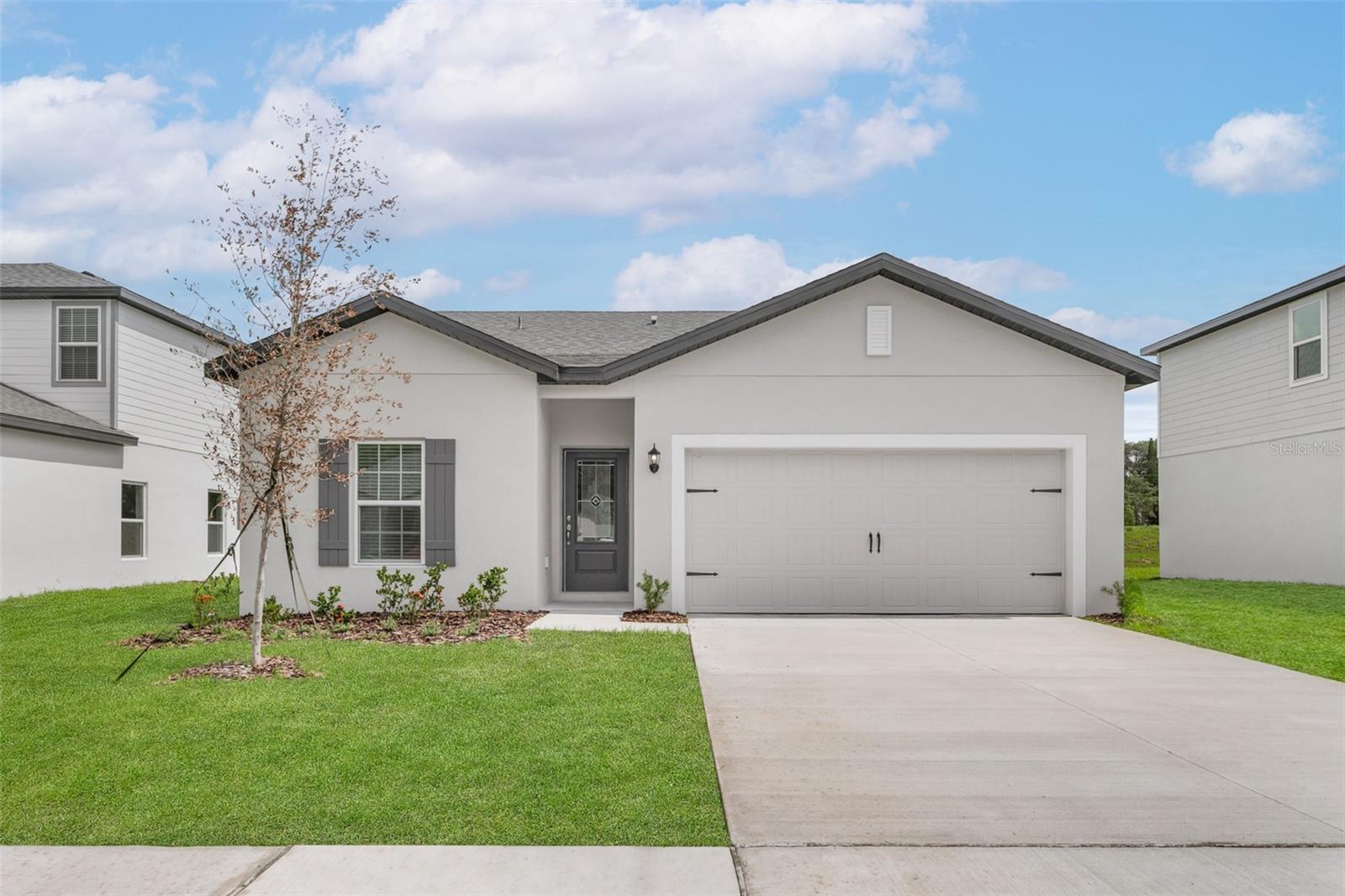 Welcome to this stunning 3-bedroom, 2-bathroom home in the desirable Tula Parc community of Astatula! Offering an abundance of living space and modern upgrades, this home is designed for both comfort and style.
Step into the gourmet kitchen, where you’ll find energy-efficient Whirlpool® appliances, granite countertops, 36-inch upper cabinets with crown molding, USB-compatible outlets, LED flush mount lighting, and luxurious vinyl plank flooring. The open-concept layout flows seamlessly into the living and dining areas, perfect for entertaining or relaxing with family.
The spacious master bedroom boasts scenic backyard views, a large walk-in closet, and a spa-like en-suite bathroom complete with a gorgeous vanity, ample cabinet storage, and a step-in shower. Two additional bedrooms provide flexibility for guests, a home office, or a growing family.
Outside, enjoy the mature landscaping in the front yard and the convenience of an attached two-car garage. Within the Tula Parc community, you’ll have access to a gazebo and playground, perfect for enjoying the Florida sunshine.
Nature lovers will appreciate the home’s prime location near Little Lake Harris, offering boating, fishing, and kayaking. With nearby parks, nature reserves, and golf courses, outdoor recreation is just minutes away. Plus, Orlando’s world-class theme parks, shopping centers, and dining options are just a short drive, making it easy to enjoy a day of adventure and entertainment.
Don’t miss this opportunity to own a beautifully upgraded home in Tula Parc—schedule your showing today!