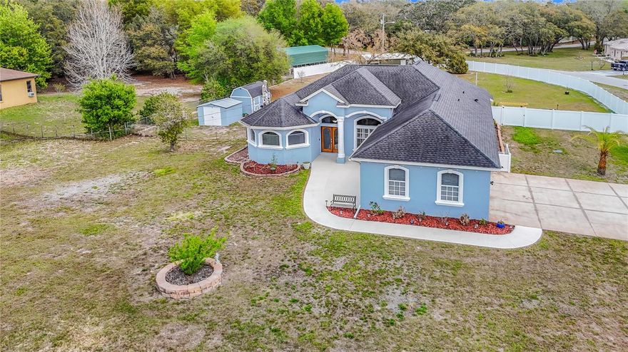 Major Price Improvement on this stunning oasis at 18520 Oakway Drive in Hudson, Florida, where the Florida lifestyle meets spacious living! This beautifully upgraded home is nestled on an expansive 0.92-acre corner lot, offering both elegance and room to breathe. The interior boasts modern finishes, featuring brand-new appliances and high-gloss refinished travertine flooring that create a stylish atmosphere throughout. Step outside to your private outdoor retreat, complete with a newly installed privacy fence that encircles the manicured yard. Dive into relaxation in the heated pool with a spa, all under the tranquil cover of a screened-in lanai. The inviting living room, adorned with a striking marble wood-burning fireplace and built-in storage, serves as the perfect gathering space, while a convenient half bath with pool access enhances the entertaining experience. The expansive primary suite is a true sanctuary, highlighting dual walk-in closets, a luxurious walk-in shower, a whirlpool tub, and dual vanities bathed in natural light. Additional bedrooms feature luxury vinyl flooring, spacious closets, and a beautifully renovated shared bathroom, providing comfort for family or guests. With a three-car driveway and garage, plus two storage sheds this home has it all. This is an entertainer's dream that stands out in the market—don’t miss your chance to own a piece of paradise in Hudson! 2025 - New Appliances, 2025 Work Area, 2025 Vinyl Fencing, 2025 Refinished flooring, 2025 New AC. Roof 2017
Remediated full insurable. Remediation completed 2010