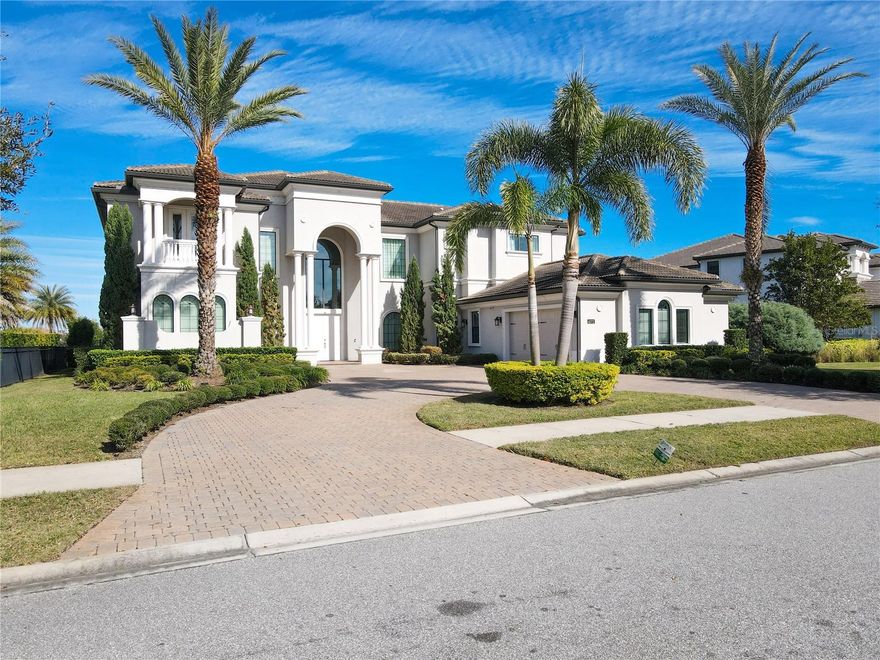 Welcome to CASABELLA at WINDERMERE the world of luxury!!!! Windermere voted one of the top 10 places to live in Florida! 
Once you enter this magnificent home you are sure to be impressed by the openness that the 24ft ceilings give you, with 2 story windows overlooking the tranquil beauty view of the enormous, heated pool/spa with infinity edge, overlooking the pond and fountain, it truly is your own outdoor oasis for entertaining friends and family or your own staycation! This stunning home boast over 6,800 Sq/Ft with 7 Bedrooms, 8 Full Bathrooms, a powder room and media room. All 5 family bedrooms are ensuite bedrooms and the 2 guest bedrooms has a Jack and Jill bathroom. The media room also has the uncommon amenity of a full bathroom as well. it truly is a feast for the eyes when you walk through the front door and you are welcomed by gorgeous views of the magnificent and modern formal living room overlooking all of the water views, from the huge infinity edge pool and spa to the pond/fountain.  Casabella is oh so perfectly situated in the heart of Windermere, a neighborhood very much known for its top-notch golf courses and "A" rated schools, located in very close proximity to renowned amusement parks with easy access to major highways, as well as an endless array of upscale dining, shopping and entertainment all at your fingertips. Room Feature: Linen Closet In Bath (Bedroom 2).