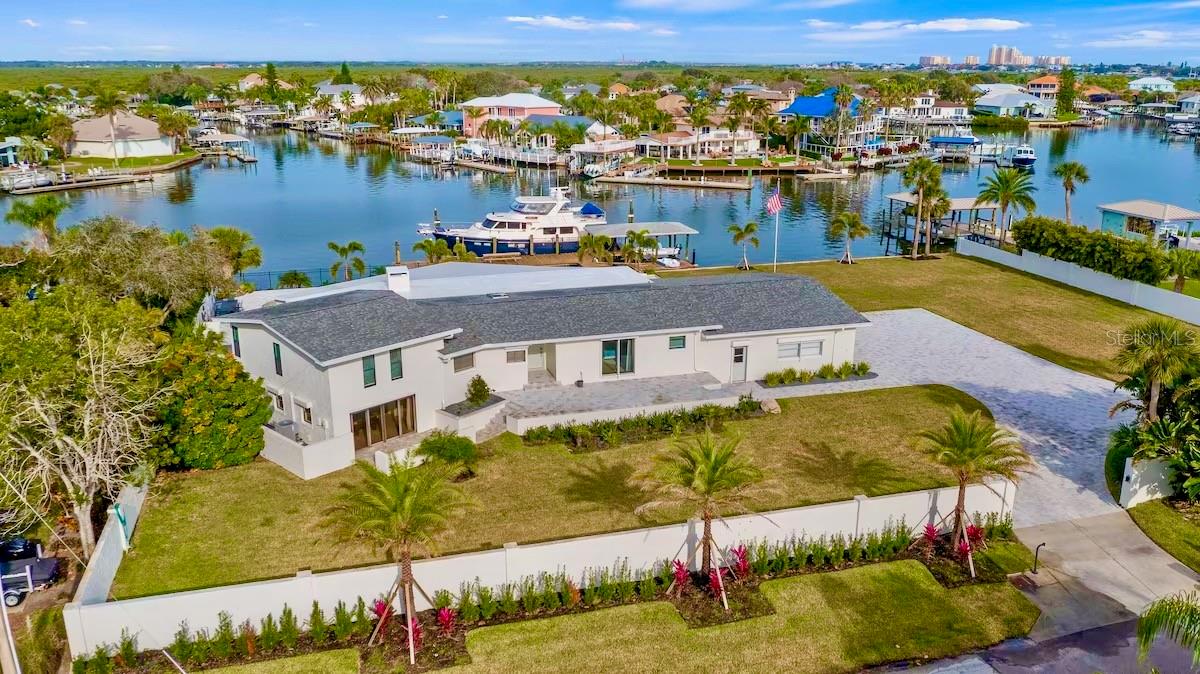 Waterfront Luxury Retreat in New Smyrna Beach
Experience the ultimate in coastal living at this beautifully appointed waterfront home, where luxury and comfort come together in perfect harmony. Bring your own boat or rent one from nearby Gerry’s Marina and enjoy direct access to the Intracoastal Waterway. Spend your days cruising to Disappearing Island, dining at waterfront restaurants, or fishing in the abundant local waters.
This exceptional home features three spacious bedrooms and three and a half bathrooms, offering plenty of room for families or groups. Inside, the open-concept layout creates a seamless flow between the inviting living area, a stylish bar, and a cozy fireplace—ideal for entertaining and relaxation. The game room adds a fun and versatile space for guests of all ages.
Step outside to enjoy your own private oasis. The refreshing pool and cozy fire pit set the stage for unforgettable evenings under the stars. Whether you're hosting a sunset gathering or enjoying a quiet morning coffee by the water, the outdoor living space is designed to maximize your enjoyment of the beautiful surroundings.
Just beyond the property, New Smyrna Beach offers a world of adventure and relaxation. Explore the vibrant marine life with a snorkeling or diving trip, or try paddleboarding and jet skiing for a thrill on the water. Surfing lessons, scenic nature walks, and local art galleries add even more charm to your stay. When it’s time to unwind, indulge in fresh seafood at nearby waterfront restaurants and browse the area’s unique shops.
Whether you’re a nature lover, an adventure seeker, or simply looking to relax in a stunning setting, this home in New Smyrna Beach delivers an unforgettable escape.