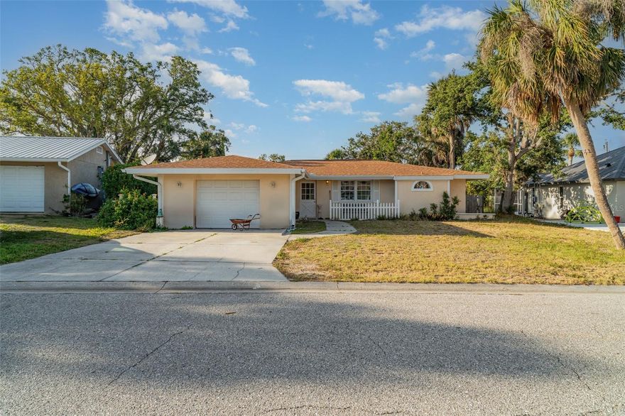 Discover this charming 3-bedroom, 2-bath home in the highly sought-after Casas Bonitas community, where comfort meets peace of mind. Situated 23 feet above sea level with no history of storm damage and no flood insurance required, this well-maintained gem features a new roof, A/C, and water heater—all updated in 2019. Enjoy the Florida lifestyle with a screened-in pool, elegant crown molding throughout, and a desirable split floor plan for added privacy. The home also offers an oversized one-car garage and a fenced yard, perfect for both relaxation and entertaining.
