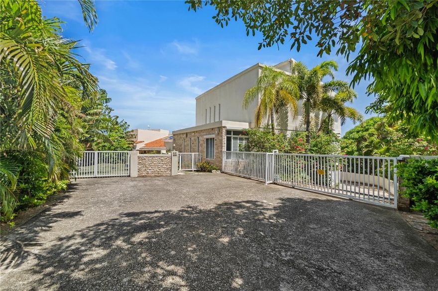 Located in the exclusive Palmas del Mar Ridge Top pocket, this 5,320 SF home on a 2,636 SM lot is the ultimate party house. 
Featuring a separate studio, ample garage space, and an infinity pool with views of Vieques and Culebra Islands, this tropical mansion is the perfect abode.The three-story home boasts a spacious open layout; 4 bedrooms + 1 studio, 6 full bathrooms + 3 half bathrooms.
Embrace the freedom to personalize this exclusive address into your dream oasis.