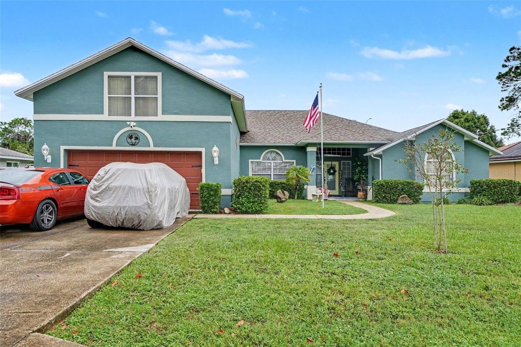 Photo of 75 Brownstone Lane, Palm Coast, FL 32137 (MLS # O6448406)