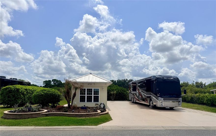 Welcome to Lot 42 in Florida Grande Motor Coach Resort—where comfort, privacy, and 
effortless luxury come together. This beautifully maintained 7,774 sq ft, north-facing, back-in lot 
is ideally situated on a quiet street and features a desirable pie-shaped layout, offering additional 
space behind the living area for enhanced privacy and relaxation. 
The impressive 26’ x 76’ concrete pad is equipped with full motorhome hookups and 
complemented by additional pavers along the pedestal side and behind the Grande Suite, creating 
both function and visual appeal. From the moment you arrive, the lush front landscaping sets the 
tone with outstanding curb appeal. 
Enjoy Florida living at its finest under the 12’ x 16’ covered patio, complete with a ceiling fan—
perfect for morning coffee or evening gatherings. 
The 384 sq ft Grande Suite, only a few years old, has been meticulously designed and comes 
fully furnished. Inside, you’ll find a sophisticated trey ceiling, tile flooring throughout, and 
thoughtfully curated finishes. The kitchen area features two-toned cabinetry, solid surface 
countertops, a large sink, beverage fridge, microwave, and a stylish backsplash that adds an extra 
layer of elegance. 
The full bathroom is equally impressive, boasting a walk-in shower with heavy glass doors. A 
rear laundry/storage room includes an LG ThinQ washer and dryer, built-in storage, and a water 
softener—offering convenience and practicality without compromise. 
Located in the heart of Central Florida, Florida Grande Motor Coach Resort caters exclusively to 
Class A and Super C motorcoaches and offers an unmatched lifestyle. Enjoy easy access to 
Tampa, Orlando, and Ocala—each about an hour away—and The Villages just 30 minutes from 
your doorstep. 
Beyond its prime location, the resort is known for its vibrant and welcoming community. 
Residents enjoy a wide range of amenities and activities including yoga, fitness classes, line 
dancing, pickleball (with 10 courts!), crafting, cards, and more. Relax by the pool, visit the dog 
park, or take part in the lively social scene featuring food trucks, community dinners, live 
entertainment, trivia, bingo, karaoke, and tournaments. 
Known as Florida’s friendliest motorcoach resort, Florida Grande offers more than a place to 
stay—it offers a true sense of belonging. Lot 42 is ready to welcome you home.