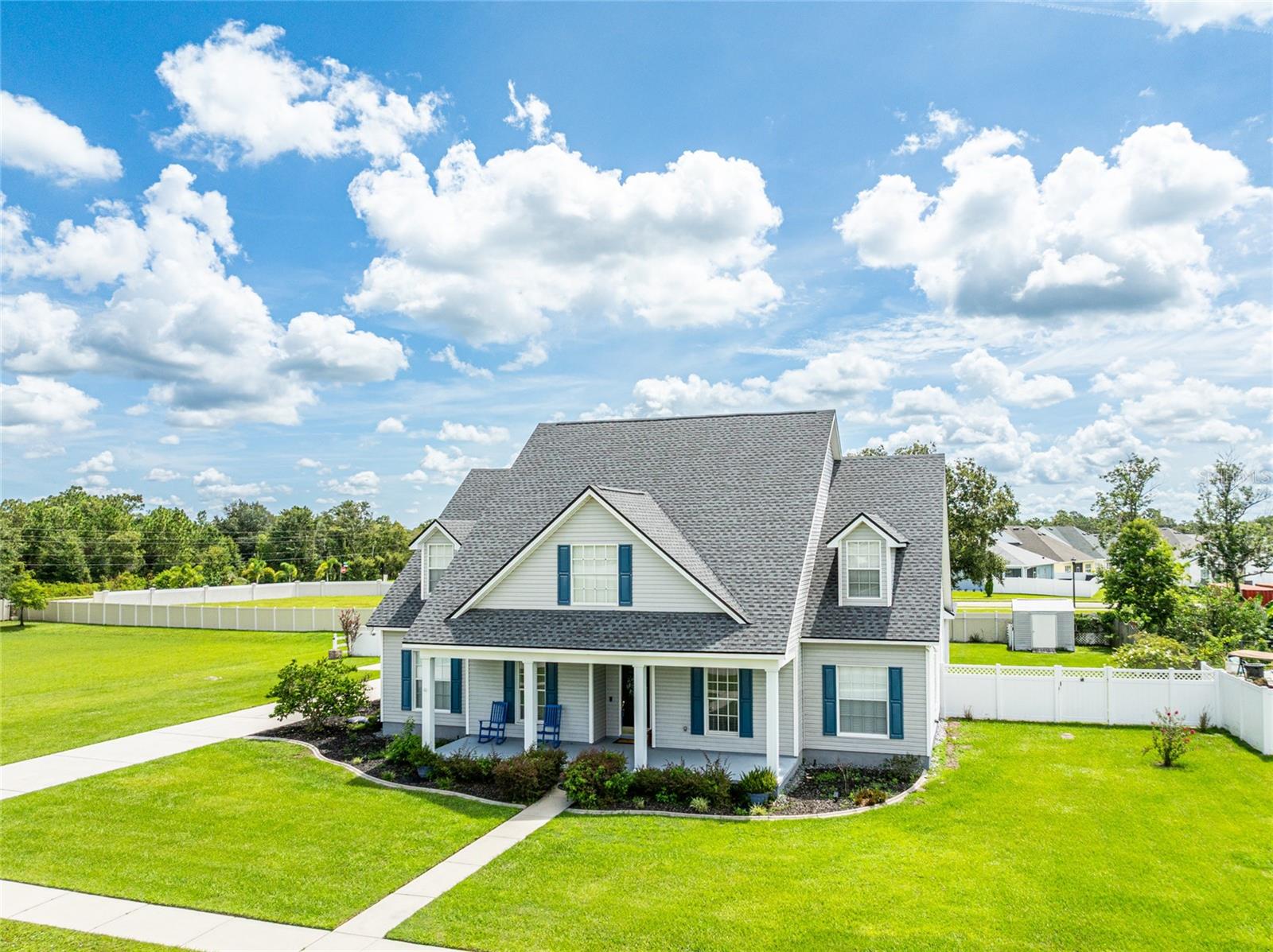 Welcome to Panther Run with NO CDD and super low HOA! This home features a brand new roof and plenty of room to bring your RV or boat! With beautiful southern charm and practicality this updated four bedroom plus bonus room, three and half bathroom, custom built home, sitting on an expansive .45 acre lot has much to offer. Within the highly sought Land O’ Lakes community of Panther Run, it showcases a picturesque enclave of 19 custom homes on half acre lots! Lot large enough to build a detached garage or workshop. From the lovely front porch, to the detailed interior finishes, this home exudes quality. Step inside to appreciate the vaulted ceilings, classic crown molding, and new interior paint throughout. Th new flooring, installed in 2022, flows seamlessly throughout the living areas. Host gatherings in the formal dining room or relax by the wood burning fireplace in the family room. Family room features custom built-in entertainment center. The exuberant kitchen, remodeled as of 2022, is equipped with a functional island, new cabinetry, stainless steel appliances, and a dinette space. Spaciously designed for comfortable living, the main floor includes the master suite with dual walk-in closets and an en suite bath featuring dual sinks and a garden tub. A second bedroom and full bathroom are also conveniently located downstairs, offering ideal arrangements for guests, in-laws, or a home office. Upstairs offers a large bonus room that provides additional space for any need, situated next to two more comfortable bedrooms. This home features a dedicated laundry room with built-in sink and cabinets. The fully fenced backyard offers privacy to create your own sanctuary. The extended driveway allows for plenty of room for visitors or boat and RV parking. Don't miss this opportunity to own a move-in-ready, custom home completely updated with lots of flexibility. Panther Run is conveniently located to US 41, SR 54, the Suncoast Parkway, and I-75. Enjoy top-rated schools, dining at the finest restaurants, endless shopping at The Shops at Wiregrass, Tampa Premium Outlets, KRATE outdoor mall, medical facilities, and all the greatest the up and coming Pasco County has to offer!