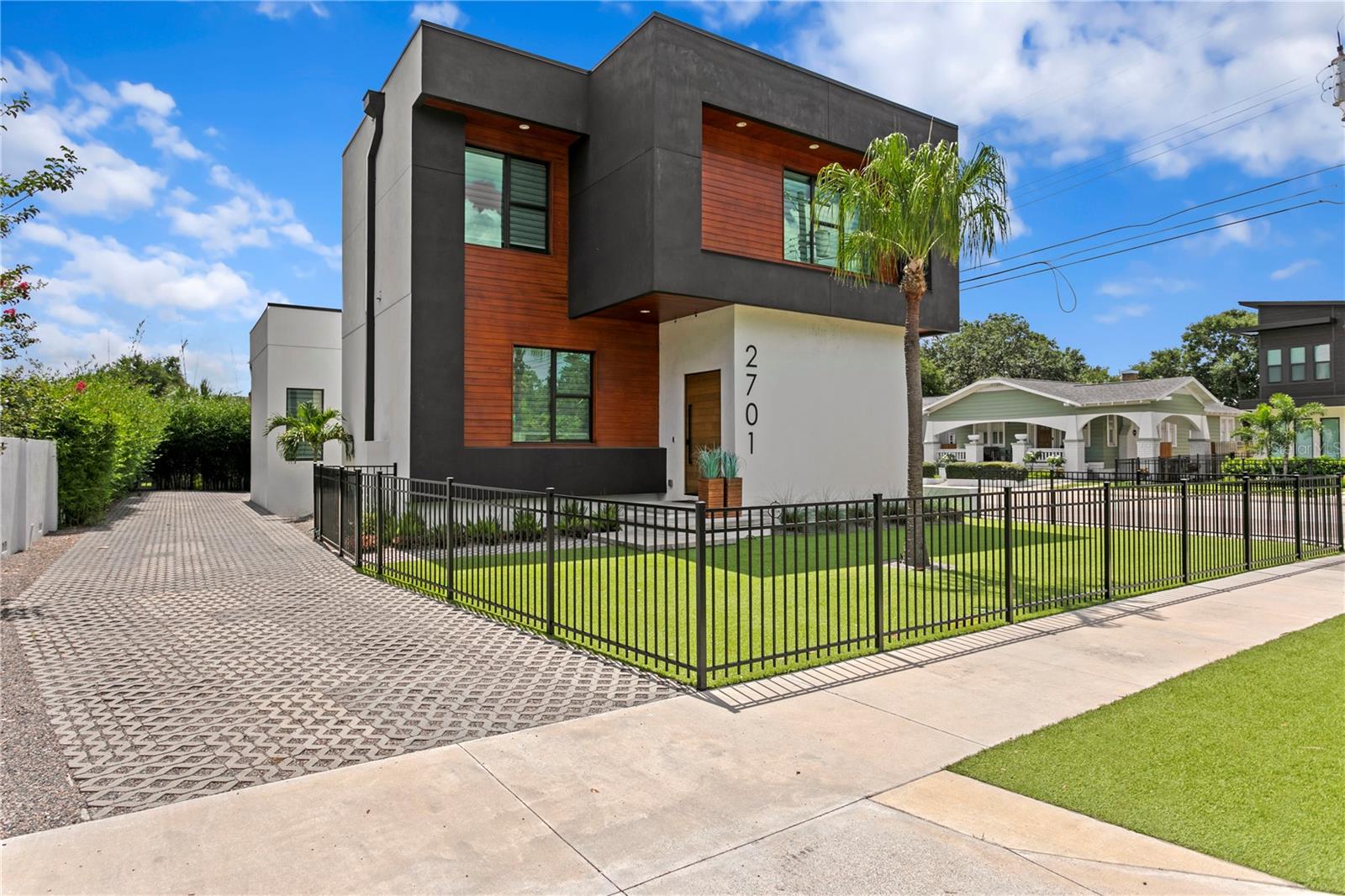 Modern Luxury meets Timeless Artistry in this 2022 built masterpiece, perfectly positioned in one of Tampa’s most sought out after neighborhoods, Riverside Heights. Walking in you’ll be greeted by soaring 12’ ceilings as they set the stage for an open, airy ambience, while bespoke design touches create an elevated living experience. This 4 bedroom, 4.5 bathroom home features a desirable first floor bedroom suite plus a detached one bedroom, one bathroom retreat- ideal as a wellness studio, private office, or versatile guest space. The heart of the home is wrapped around the most beautiful kitchen with stunning powder blue lacquered cabinetry along with the dramatic waterfall edge quartz bar anchors the space alongside premium stainless steel appliances, generous eat in seating, and thoughtful storage. Beautiful flooring throughout enhances the home’s sleek and artistic character. Head upstairs and find the master retreat with the most beautiful skylights in the primary bathroom equipped with two walk in closets. You'll also find a convenient space upstairs and 3 additional bedrooms along with two bathrooms upstairs. Expansive windows invite natural light and frame the inviting outdoor living area- perfect for intimate gatherings or weekend entertaining. Enjoy the convenience of walking to Armature Works and exploring what the Heights’ has to offer along with their vibrant dining scene, with beloved family owned restaurants just steps away. Minutes from Downtown Tampa 15 minutes from Tampa International Airport, and 30 minutes away from some of the best beaches. This is more than a home- it’s a statement of modern elegance in the heart of Tampa.