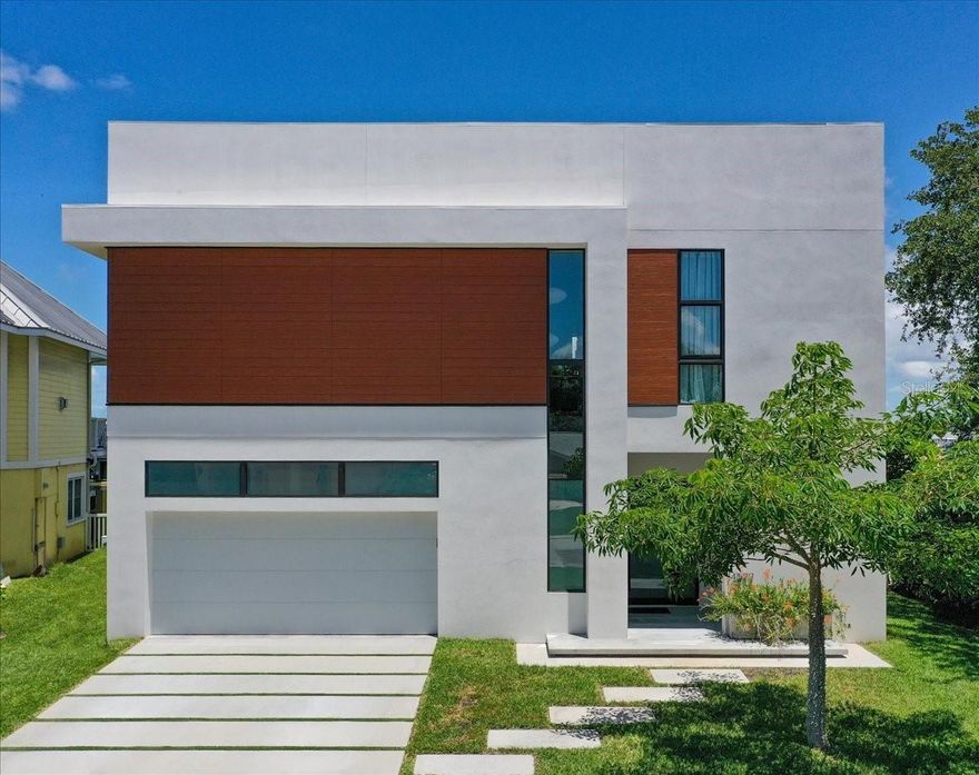 One or more photo(s) has been virtually staged. LUXURIOUS AND CONTEMPORARY, WITH THE PERFECT L.A. BLEND OF MINIMALISTIC ELEGANCE, SUPERIOR FORM AND ADVANCED FUNCTION, THIS VISUALLY-STUNNING WATERFRONT RESIDENCE WAS BUILT WITH REFINED IMAGINATION AND YEARS OF FORWARD-THINKING! Remarkable planning and extraordinary attention to the smallest of details have yielded a home that breathes a beautifully rare and clean simplicity. High ceilings, tall windows, elegant engineered hardwood flooring and finishes designed to “float” throughout the home, deliver a deeply-satisfying, Andy Worhol-like living experience. Modern concept kitchen features inconspicuous white cabinetry, high-quality stainless steel appliances, gas cooking, quartz counters, large island bar and a wonderful multi-function pantry hidden away from the home’s open areas. Superb built-ins offer a distinct art deco flare that complement posh, state-of-the-art lighting and generous use of skylights. The inspired living area, with its sleek fireplace illumination, transitions to a fabulous open dining space overlooking the waterfront. Through pocketing sliding glass, take in grand, sweeping and unobstructed water views made possible by exquisitely-engineered cantilevered construction. Bringing all of your waterfront into view, you’ll love the expansive, 50 ft-wide (approx.) covered balcony with pristine porcelain floors, exterior marble façade, bench, planter and built-in gas for outdoor cooking & firepit. The owner’s suite enjoys private balcony access, neo-contemporary built-ins and a richly detailed closet system. Owner’s bath is a lavish, pampering experience; with its own unique combination of materials, design and color, you’ll be enthralled by the purity of concept in the partially-open rainshower, sublime soaking tub and custom double vanity – merging vintage wood credenza and modern granite surfaces. Large 2nd bedroom complements owner’s suite in style & substance. You’ll be drawn to the delightfully-appealing guest bath and its amazing use of light, tilework and composition. Plush theater room functions as a 3rd bedroom. Lower-level entry foyer has a rich welcoming feel, and extensive multi-purpose/storage space. Out back, discover 2 sizable covered private waterfront decks overlooking a gorgeous Pebbletech pool. Updated seawall, composite dock, backup generator, and many extras. Brilliantly conceived, and exceptionally well-built.