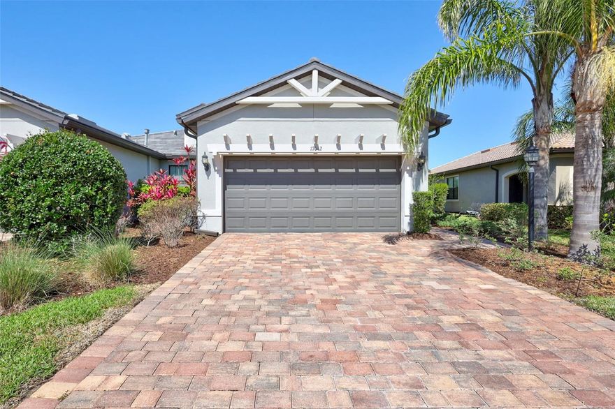 Don’t Miss Out on this immaculate, move-In ready, SERENITY VILLA! Nestled in the heart of the area’s #1 55+, maintenance free community, Del Webb. This stunning villa is perfectly situated on an expansive, picturesque lot. Offering 1,543 sq ft of luxurious coastal living, this charming home features 2 bedrooms, 2 bathrooms, and a versatile den, ideal as a home office, gym, craft room, or any space tailored to your lifestyle. Built in 2019, this bright and cheery villa boasts an open floor plan that’s perfect for both relaxation and entertaining. Step into the spacious kitchen equipped with solid wood cabinets, sleek granite countertops, stainless steel appliances, a gas range with air fryer, microwave, a pantry, and a breakfast bar with seating for two. Neutral ceramic tile floors flow throughout the home, complementing the custom shades and draperies adorning the windows, enhancing its bright and welcoming atmosphere. The owner’s retreat is your personal sanctuary, complete with an ensuite that offers a large walk-in shower, dual sinks, and a custom walk-in closet, a homeowner’s dream. Your guests will appreciate the large bedroom and the convenience of a second full bathroom, featuring a tub/shower and plenty of space for comfort and privacy. Extend your living space to the outdoors with the expansive tree line view lanai, where you can entertain guests or simply unwind and enjoy the breathtaking conservation area views and the quintessential Florida weather. Del Webb community at Lakewood Ranch boasts an array of amenities, including a state-of-the-art fitness center, inviting resort style swimming pool with lap lanes, 6 tennis courts, 8 pickleball courts, and 4 bocce ball courts. The 21,000 + SF clubhouse offers multiple activity and gathering rooms, group fitness studio, catering kitchen, full time social director and card/game/billiards rooms. The community often hosts events for a vibrant social scene.