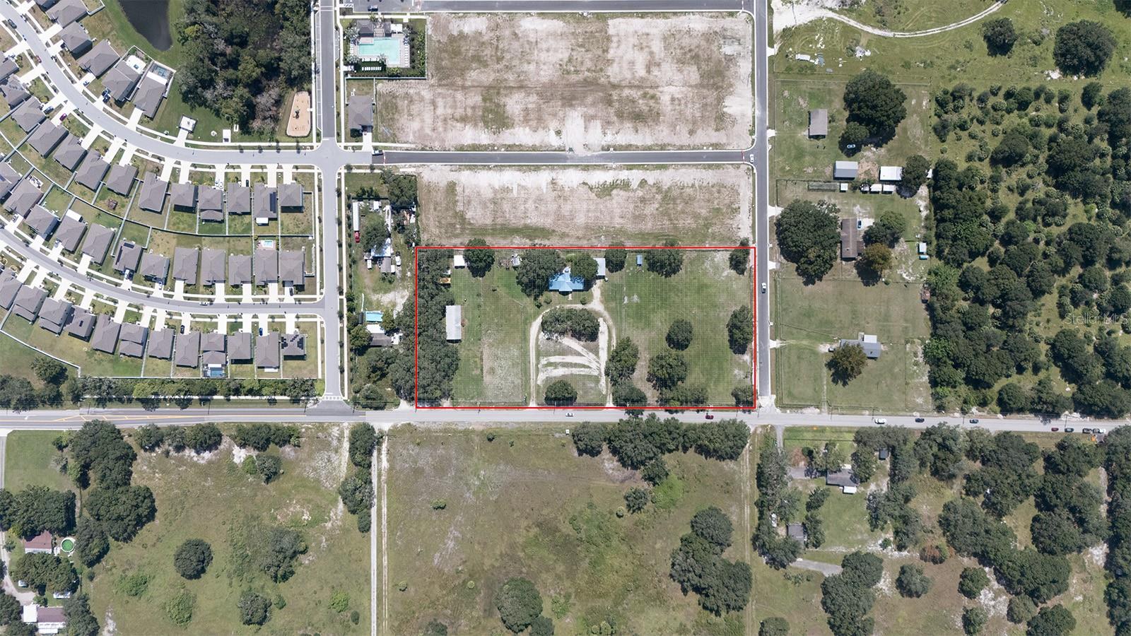 Location Location Location! This 2-bedroom, 2-bathroom home sits on 4.5 acres in a prime development area- ideal for potential apartments, medical offices, or professional business uses. Just one minute from St. Joseph's South Bay Hospital and I-75, this property is a fantastic opportunity for assisted living facilities, skilled nursing centers, or other healthcare-related ventures.