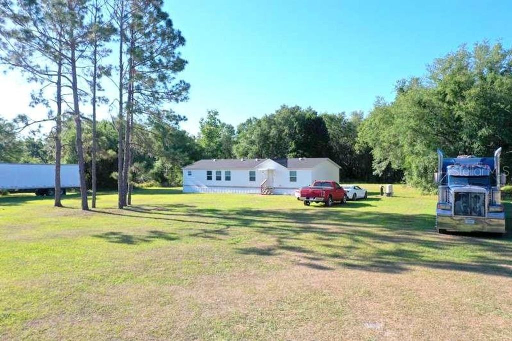 Photo of 31326 Tyndall Road, Wesley Chapel, FL 33545 (MLS # TB8501351)