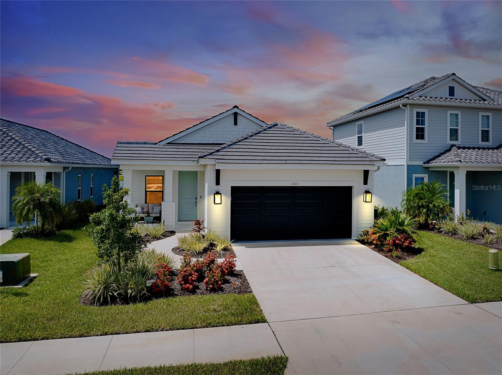 Move-In Ready, Heavily Upgraded Home with Water Views in a Premier Gated Florida Community. Skip the wait of new construction—this beautifully upgraded, nearly new home is ready for immediate enjoyment! Featuring 3 bedrooms plus a versatile den, this open-concept split floor plan offers the perfect blend of comfort, functionality, and Florida lifestyle. The home showcases high-quality luxury vinyl flooring, crown molding, tray ceilings, and top-of-the-line finishes throughout. Entertaining is effortless with a spacious extended lanai that includes a custom outdoor kitchen and grill, all overlooking a tranquil pond. Enjoy added privacy and security with a fully fenced yard and impact-rated windows adorned with plantation shutters and automatic shades on the triple-panel hurricane sliders. Additional premium features include: Gourmet kitchen with quartz countertops, large island, and walk-in pantry, indoor/outdoor built-in speaker system, Portable gas generator hook-up, water filtration system, high-end ceiling fans and fixtures throughout. The expansive great room and serene owner’s suite both offer picturesque pond views. Two additional bedrooms share a guest bathroom on the opposite side of the home, and the den provides flexible space for a fourth bedroom, home office, or hobby room. Situated in a sought-after, gated maintenance-free Neal community, residents enjoy resort-style amenities including: Clubhouse and multiple pools, tennis and pickleball courts, fitness center and miles of walking/biking trails, through scenic nature preserves, and a dog park. All of this comes with low HOA fees in a prime location—just east of I-75 and minutes from world-famous Siesta Key Beach. Enjoy quick access to upscale shopping, dining (from gourmet to waterfront tiki bars), and all the best Sarasota has to offer. This is more than a home—it's your gateway to the Florida lifestyle. Schedule your private tour today!