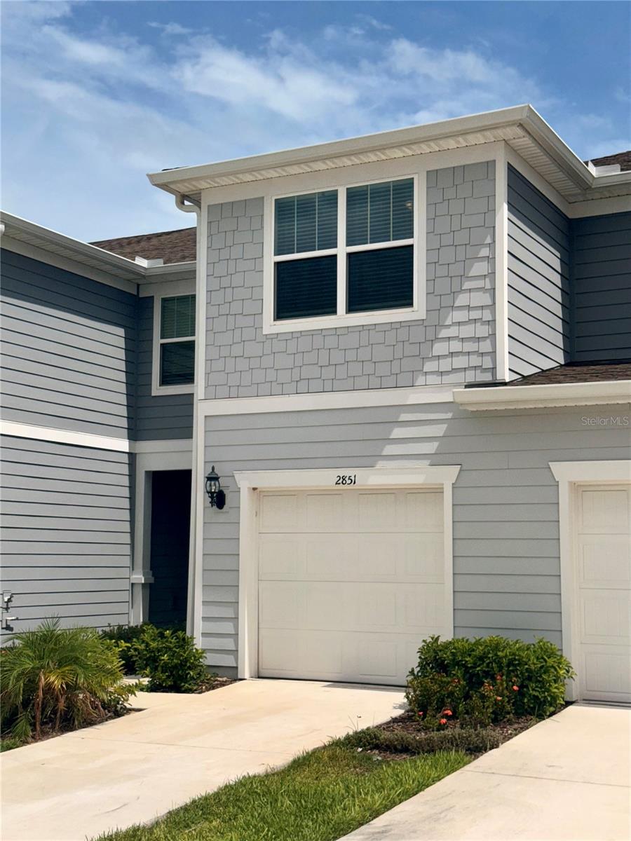 Discover the perfect blend of style, comfort, and convenience in this beautifully designed Springdale two-story townhome, ideally located in the sought-after Belle Haven community. Positioned near the amenity center and offering added privacy with no direct rear neighbors.
Inside, you'll find 3 spacious bedrooms, 2.5 bathrooms, a single-car garage, and a covered lanai—ideal for relaxing or entertaining. The open-concept first floor showcases a stylish kitchen with elegant coffee cabinetry, Maple quartz countertops, a pantry, and designer Perla tile flooring that flows through the main living areas. The café and gathering room are perfect for hosting, while the convenient powder room adds functionality.
Upstairs, retreat to the serene Owner’s Suite complete with a large walk-in closet and an en suite bath featuring dual quartz vanities, a private water closet, linen storage, and a walk-in shower. Two additional bedrooms, a full secondary bath, and a laundry room.
This home comes move-in ready with upgraded Villanova cabinetry, designer tile accents in the kitchen and baths, and soft, stain-resistant carpet in the bedrooms and upstairs living areas.
Located just minutes from Hwy-27, I-4, SR-429, and Posner Park’s shopping, dining, and entertainment, Belle Haven offers low-maintenance living with resort-style amenities including a pool with cabana, playground, open green spaces, and more. Plus, enjoy the added value of included Spectrum Gigabit internet and TV with no CDD fees.