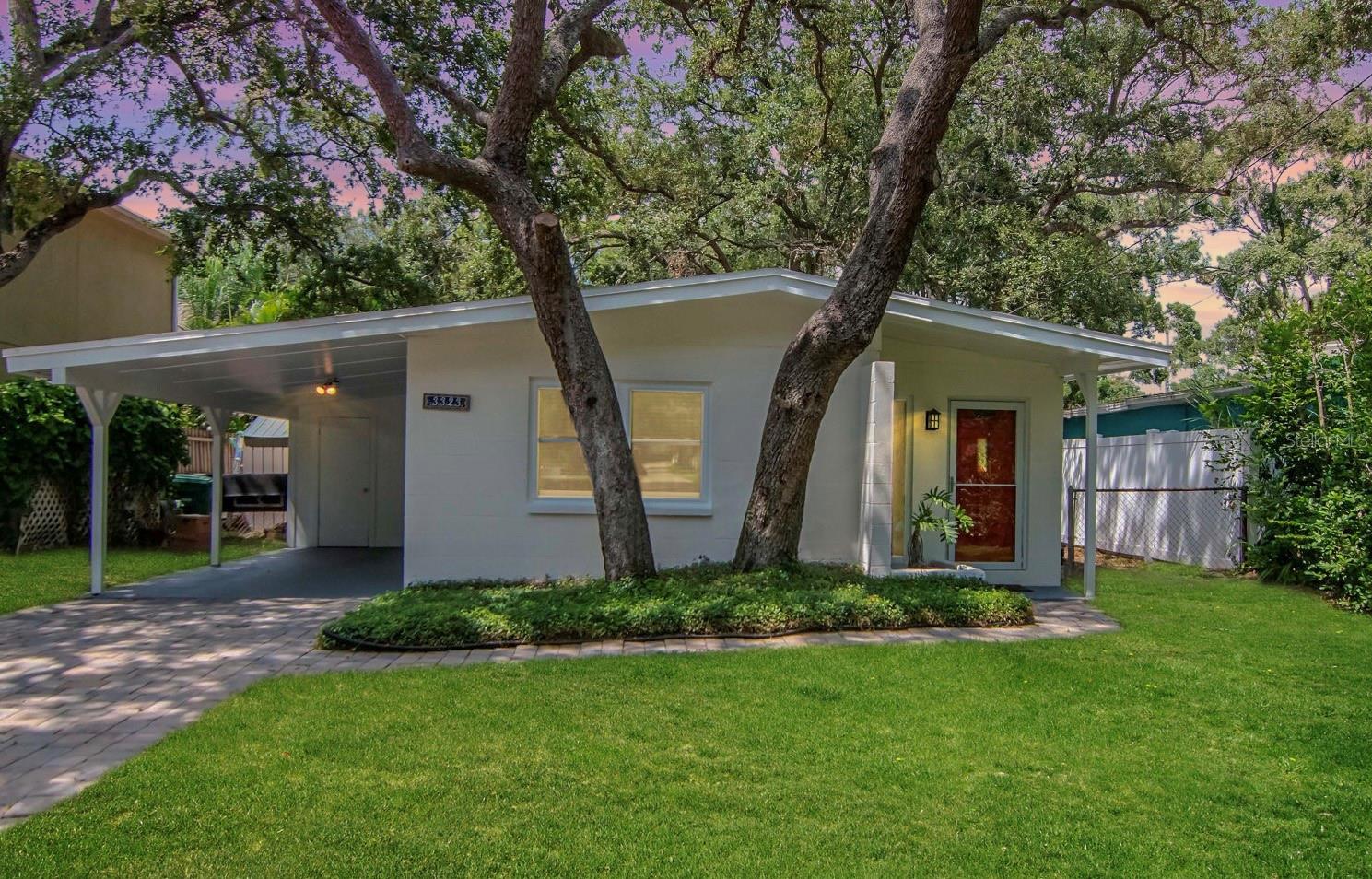 This cute-as-a-bug South Tampa abode proves that great homes can still be found at a price you can afford. Walkable to Bayshore Boulevard, it’s full of charm, convenience, and peace of mind—safely outside the flood zone and completely unaffected by last year’s hurricanes.
Step inside to a welcoming living and dining room combo with well-preserved terrazzo floors, flowing into an efficient kitchen and two comfortable bedrooms. The original 1958 bathroom maintains its vintage character with a newly reglazed tub and tile (2025).Outside, a convenient Utility room with washer/dryer, covered carport and enjoy an oversized yard—a rare bonus in South Tampa—perfect for relaxing or entertaining. Hurricane-rated windows (2025) and fresh exterior paint (2025) add even more appeal.
From morning jogs along Bayshore Boulevard, to evenings exploring nearby South Tampa dining, shopping, and nightlife, this home puts you right in the center of it all. With durable block construction, thoughtful updates, and an unbeatable walkable location, this is a rare find.