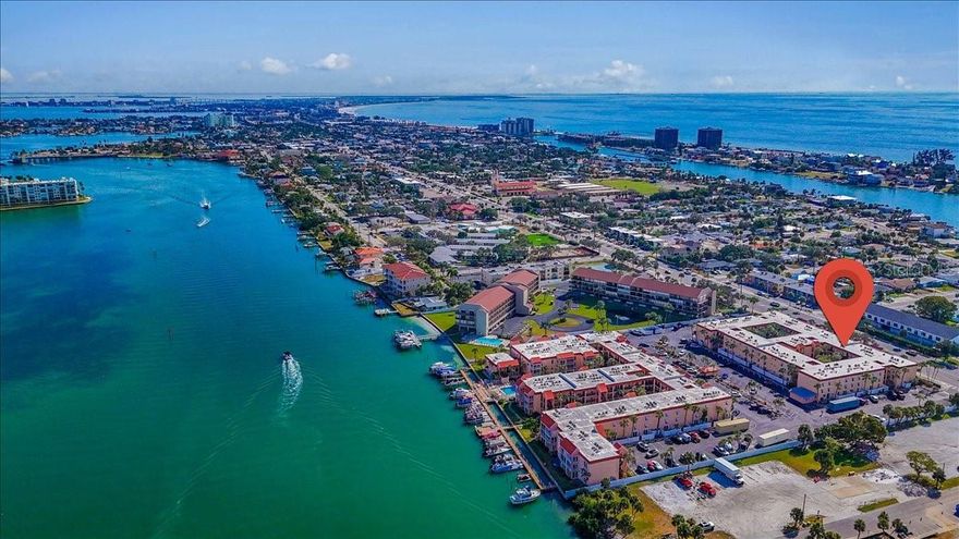 Turnkey 2BR/1BA condo in the gated Boca Shores community, just ½ mile from the beaches of St. Pete Beach. This second-floor residence is move-in ready and well-maintained, featuring no storm damage, vinyl flooring, fresh paint (2022), new HVAC (2020), water heater (2023), updated electrical panel (2022), and new kitchen plumbing. The private, oversized balcony has no unit below, offering added privacy and outdoor enjoyment.

Community amenities include landscaped courtyards, picnic and BBQ areas, a heated pool overlooking the Intracoastal Waterway, clubhouse with sauna, fishing dock, kayak and bike storage, a self-serve car wash, and on-site laundry facilities.

Twenty-one boat slips are available for rent (approximately $91/month, first-come basis). The community is pet-friendly (two pets up to 35 lbs) and allows 30-day minimum rentals. HOA fees include high-speed internet, 150 cable channels, insurance, exterior maintenance, water, sewer, and trash.

Located near Egan Park, local dining, boutique shopping, and Downtown St. Pete, Boca Shores offers convenient coastal living just minutes from Sunset Beach, with easy access to the Gulf and area attractions. Milestone inspection completed.