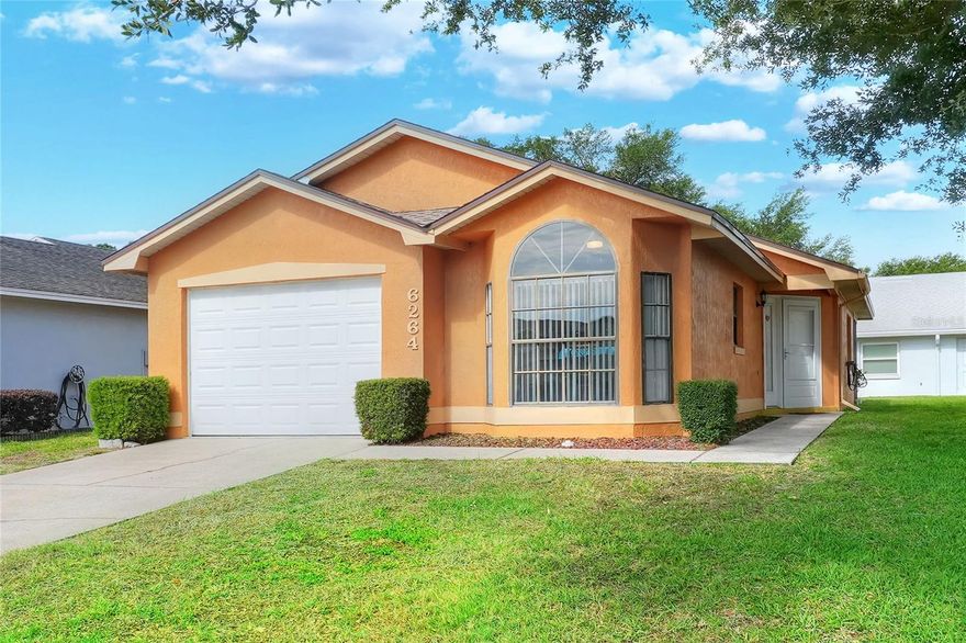 Built in 1991 and located in the 55+ community of Sandpiper Golf & Country Club, this 2 bedroom, 2 bathroom home offers a straightforward layout that’s easy to navigate and maintain. A new roof installed in 2023 takes care of one of the larger expenses, allowing the next owner to focus on settling in and making the space their own over time.

The home is arranged in a linear, “shotgun-style” layout, with the garage at the front and a private side entry that leads directly into the main living area. High ceilings in this central space help open it up, while the living room, dining area, and kitchen all connect in a simple, functional flow. The dining area sits near the front of the home with windows overlooking the yard, bringing in natural light throughout the day.

The kitchen is set along both sides of the space, keeping everything within reach and easy to use. It’s practical as it stands, with the option to update over time based on your needs.

The primary bedroom includes its own bathroom and a walk-in closet, along with direct access to a small screened porch that also connects to the living area. This outdoor space adds a quiet spot to step outside without leaving the home. The second bedroom and full bath are positioned nearby, making the layout comfortable for guests or everyday use.

Laundry is located in the garage, and the home includes a single-car garage for parking and storage.

For buyers looking for a manageable home in an established 55+ community, this property offers a simple starting point with the ability to personalize at your own pace.