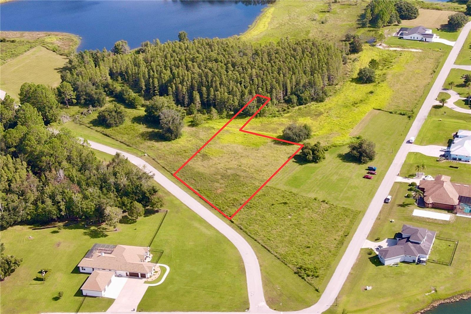 Outlaw Ridge offers seven spacious residential lots ranging from 1 to 1.88 acres, nestled within a private, gated community designed for custom-built homes. Located in a quiet and scenic setting, the community offers a peaceful atmosphere surrounded by nature
and is ideal for those seeking a quiet lifestyle.
The available lots include a mix of wetlands and floodplain areas. Many of the sites back up to wooded areas or designated conservation land, offering serene views and privacy. Utilities are well and septic.
The lots are located within Outlaw Ridge, a gated community, on Outlaw Way and Hideout Trail in Land O' Lakes in Pasco County. Outlaw Ridge is situated on Ehren Cutoff. Ehren Cutoff connects US 41 to State Road 52.
The site is approximately 10 minutes from US Highway 41, where nearby medical shopping, and schools are located. Additionally, it's 1.6 miles from State Road 52, 5.9 miles from I-75, and 7.6 miles from the Suncoast Parkway. The area offers a mix of rural and urban surroundings. Due to its proximity to major thoroughfares, it's just a short commute from Wesley Chapel (20 minutes), Dade City (25 minutes), Brooksville (30 minutes), New Port Richey (40 minutes), Tampa International Airport (40 minutes), downtown Tampa (40 minutes), and downtown St. Petersburg (50 minutes).