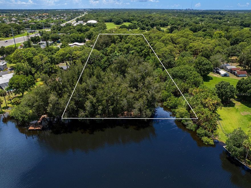 Prime development opportunity with waterfront access. Discover the epitome of waterfront living on this five-acre parcel nestled along the picturesque Braden River with Australian pines lining the waterway. This rare in town parcel offers 170 feet of seamless navigable waterway access with only one bridge to the Manatee River and access to the Intracoastal and Gulf. Bonus features include a long natural canal into the property for aquatic adventures and storage, a concrete seawall, and to top it off you have a piece of ownership on the island in the middle of the river. You are located a mere three miles from the I-75, ensuring swift access to shopping, dining, and a myriad of amenities along the new 44th Ave East corridor with a direct path to the beach and to Lakewood Ranch once the bridge over I-75 is completed. There is a detached one-car garage on the property that can be utilized as a boat house storage as well as a single-family residence that can be re-fitted as a clubhouse or both can be removed to make way for your luxurious residential or commercial endeavor. Whether envisioning a private sanctuary or a lucrative investment, this five-acre parcel epitomizes the allure of waterfront living. Don’t miss the chance to capitalize on this rare offering in one of the region’s most desirable locations. Schedule your private tour today and explore the boundless possibilities that await.