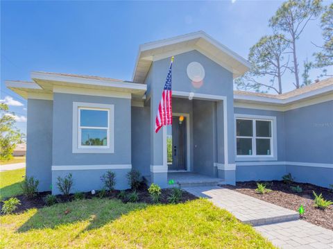 Photo of 9443 Hallendale Drive, Port Charlotte, FL 33981 (MLS # O6401334)