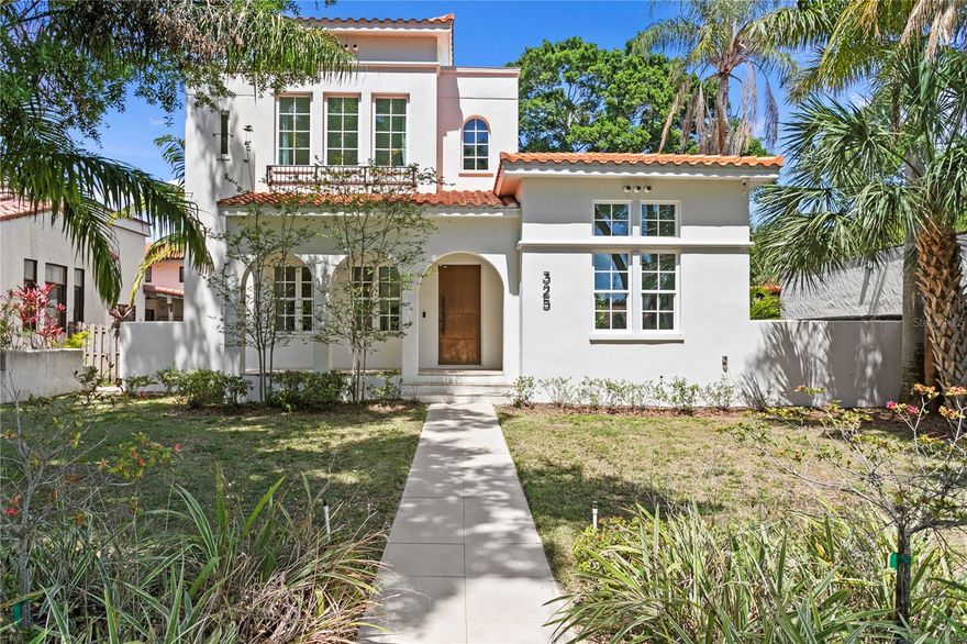 Located in the heart of St. Petersburg’s coveted Historic Old Northeast, with tranquil water views of Coffee Pot Bayou, this architecturally refined residence by MTBH — Modern Tampa Bay Homes — represents a rare intersection of contemporary design and one of the city’s most established neighborhoods. Completed in October 2021, the home spans 3,164 square feet on an 8,368-square-foot lot and offers four bedrooms and four and a half baths, thoughtfully composed beneath soaring ceilings and a clean, modern silhouette.

From the moment of entry, the home reads as intentional and composed. Wide-plank European white oak flooring runs throughout, grounding the interiors in a warm, natural palette, while expansive southern exposure fills the space with soft, consistent light. Select sightlines subtly orient toward the bayou, reinforcing the home’s connection to its surroundings. Designer lighting selections — from sculptural chandeliers to subtle recessed accents — create a layered, gallery-like atmosphere that elevates the open-concept layout.

The kitchen is both architectural and functional, anchored by a large central island and outfitted with a professional-grade Dacor Graphite Stainless appliance suite, including induction cooking and double ovens. Adjacent living spaces unfold seamlessly, framed by 10-foot sliding glass doors that fully disappear into the wall, dissolving the boundary between indoors and out.

The primary suite is designed as a private retreat, featuring its own terrace — an ideal vantage point for morning light and glimpses of the bayou — along with generous walk-in closets with custom built-ins and a sense of quiet separation from the rest of the home. Throughout, the layout offers flexibility without sacrificing cohesion — spaces that can shift effortlessly between entertaining, working, and everyday living.

Outdoor living is equally considered. A heated saltwater pool sits at the center of a fully enclosed, landscaped yard, accompanied by multiple lounging and dining areas. The outdoor kitchen, complete with built-in barbecue, and a dedicated outdoor shower create a setting that feels both resort-like and private.

Beneath the design, the home is supported by a fully integrated smart home system, seamlessly controlling lighting, climate, and security, along with whole-home water filtration for a higher standard of everyday living. These systems operate quietly in the background, enhancing comfort, efficiency, and peace of mind without interrupting the home’s clean aesthetic.

Additional features include a glass-enclosed wine room, dedicated laundry, and a spacious two-car garage.

Positioned just moments from the waterfront paths of Coffee Pot Bayou, Vinoy Park, and downtown St. Petersburg’s dining and cultural institutions — including The Dalí Museum and Chihuly Collection — this residence offers walkable access to the best of the city, while maintaining the character and prestige of the Old Northeast.

A rare newer-construction offering with water views in a historic neighborhood, this home reflects a level of design clarity, craftsmanship, and livability that is increasingly difficult to find.