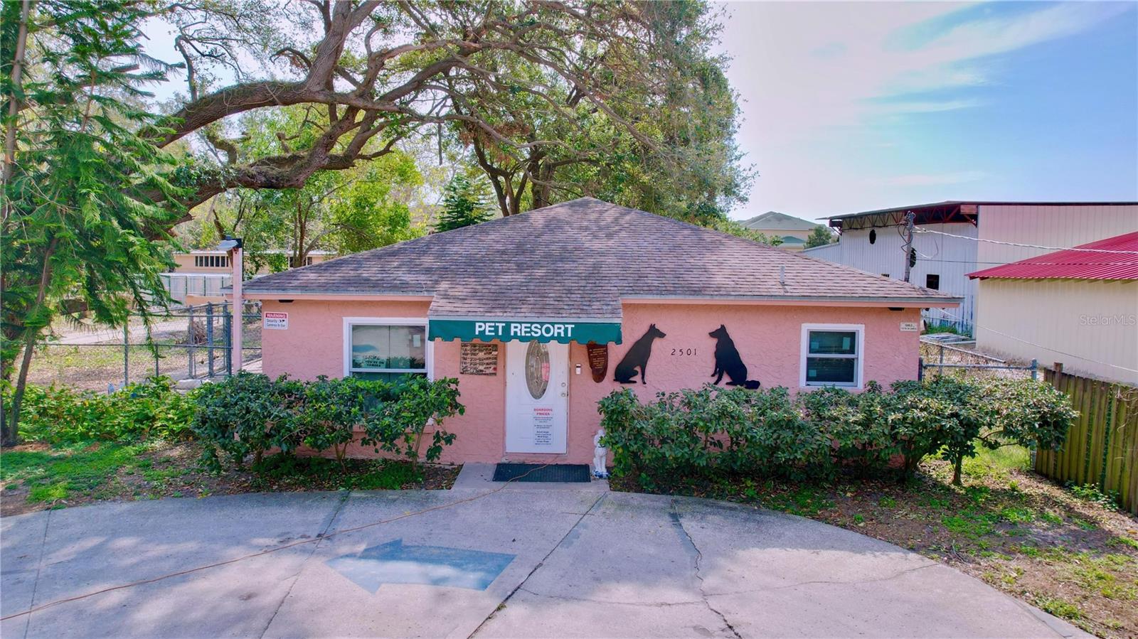 This is a great opportunity for an owner user to bring their business and live on property. This unique opportunity presents a 2-acre commercial-zoned (zoned CI -this zoning district provides areas for intense commercial activity, permitting heavy commercial and service uses) property in Tampa, Florida, featuring a well-maintained single-family pool home. There is also a separate building, approximately 500 square feet, that can be used as an office, storage, etc. The property currently has a fully operational, long established dog kennel business. However, extremely easy to redevelop the land where the dog kennels are for ample parking, add a warehouse, storage and more. Kennels and related equipment can transfer to buyer if looking for a kennel business. The well-established kennel business has been in operation since the 1990s and was once home to Westminster Champion breeds. With Commercial Intensive (CI) zoning, this property offers incredible potential for continued operation, expansion, or redevelopment. Conveniently located in Tampa with easy access to major roadways, this is a prime investment opportunity for pet care professionals, entrepreneurs, or investors.