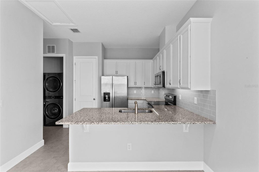 Photo of 13825 Lippman Alley #B, Orlando, FL 32827 (MLS # O6439452)