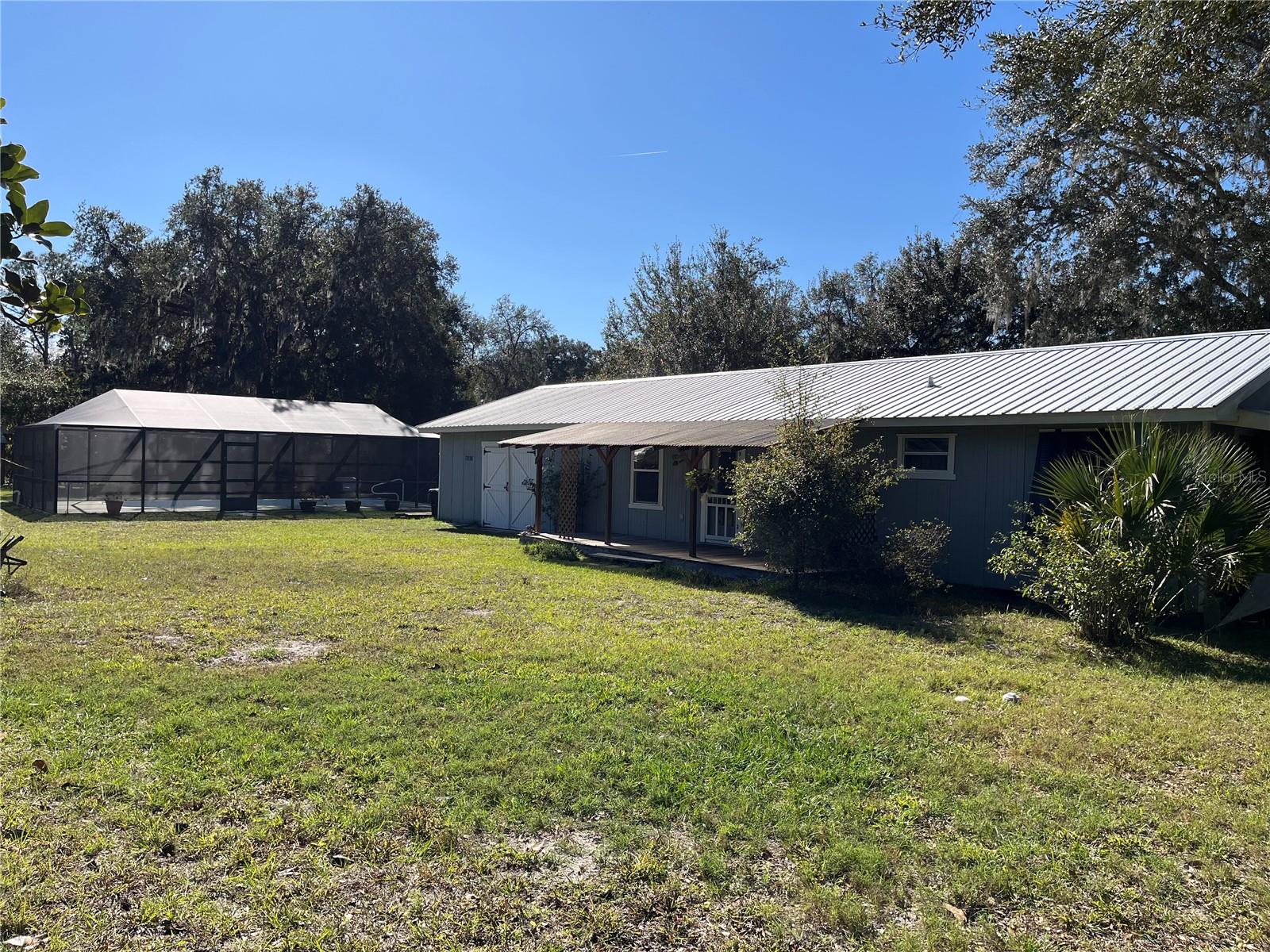 Take a look at this charming 3/2 pool home that is nestled on the Leslie Heifner canal leading out to the beautiful Withlacoochee River. Inside you will find a recently remodeled river retreat offering an open floor plan with panoramic views of the water. Spacious kitchen and living area provides plenty of room for entertaining friends and family. Enjoy the beautiful Old Florida scenery from your large soaking tub in the primary suite. The secondary bedroom features French doors leading out to a private screened in patio. Outside you will find a heated salt water pool with a recently re-screened lanai, large shed with lofted storage and detached carport. Enjoy fishing right from your dock or take a short boat ride out to the main river. This home is move in ready with a 2019 metal roof and HVAC system with built in dehumidifier. The home stayed high and dry during recent flooding and sustained no damage from the storms. Convenient location with a quick commute to Historic Floral City, Downtown Inverness and I-75/Bushnell providing an abundance of shopping dining and entertainment. Don't miss out on this nature lovers paradise, call to schedule your showing today!