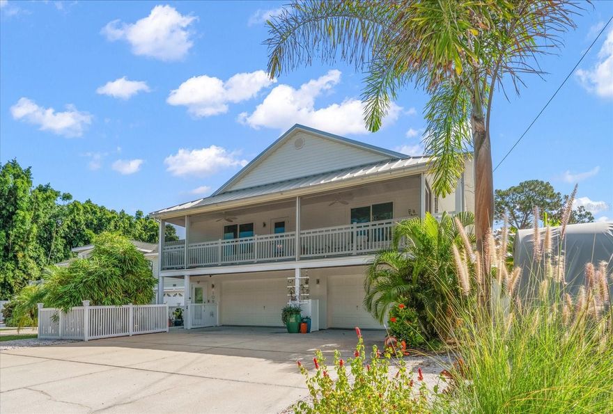 AVAILABLE FOR LONG TERM OR SHORT TERM RENTAL. Looking for a slice of paradise? This STUNNING Key West styled home is calling your name! Nestled in the highly desirable Indian Bluff Island neighborhood of Palm Harbor, Florida, this home has four bedrooms and two bathrooms upstairs, and a 400 square foot air-conditioned room and en-suite bathroom downstairs. The downstairs flex space is simply incredible- with epoxy floors and air-conditioned parking for FOUR vehicles, laundry, bathroom, and a HUGE room that could be an office, home gym, or yoga studio, this space is awesome! Upstairs, the breathtaking interior has been fully updated within the past two years, with flexible living spaces and a bright and airy floor plan, thanks to tons of natural light and recently installed hurricane rated windows, doors and skylights throughout. New luxury vinyl flooring and paint as well. In the kitchen, you’ll find solid wood cabinets with dovetail drawers, quartz countertops, and a suite of Bosch and Berazzoni appliances. An Aquasana whole-house water filtration system, renovated wood burning fireplace, completely rebuilt back deck to enjoy the stunning big sky sunrises and 30 amp RV outlet are a few amazing touches that will enhance your enjoyment of this home. And with a metal roof installed in 2019, you can rest easy knowing this home is built to last. Enjoy the Florida sunshine in your own backyard escape, with a modern saltwater pool, beautiful travertine deck, and screen enclosure installed in 2023. Or take a short stroll to the water to watch the dolphins play. Additionally, the Pinellas Trail is a third of a mile away, leading you to Wall Springs Park less than a mile from your door, and the round trip walk to Crystal Beach is about three miles. Imagine sipping sweet tea on the back porch in the morning, enjoying the trail or taking a bike ride in the afternoon, and then watching the sunset from the front porch at night, this home offers the ultimate Florida lifestyle.
