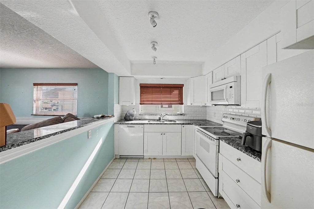 Photo of 515 129th Avenue E, Madeira Beach, FL 33708 (MLS # TB8549377)