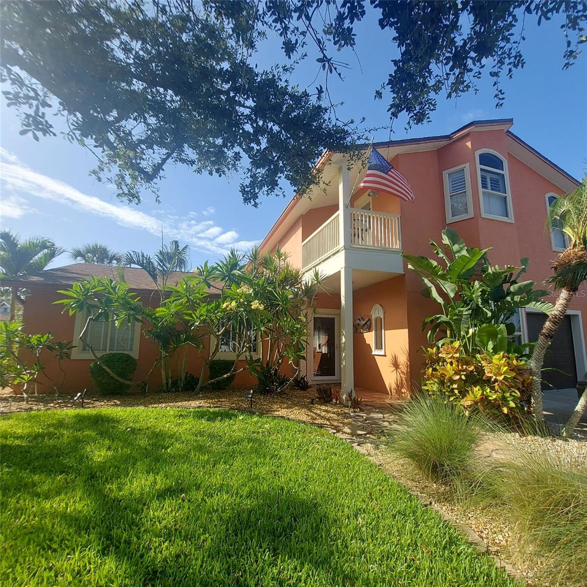 Wake up to ocean breezes in this spacious 4-bed, 3-bath home with dual primary suites—one up, one down—perfect for guests or multigenerational living. Plenty of room for all with 2,817 sqft of living, an open floor plan, formal dining, and a spacious bright family room. The upstairs suite features high ceilings, a coffee bar, huge walk-in closet, an air conditioned storage area and 2 balconies to enjoy sunsets and cool breezes. New roof, new fence, and fresh interior paint. This is an ideal retreat with lush tropical landscaping, large back deck, and an outdoor bar area that makes entertaining easy. Rinse off in the outdoor shower after walking to the beach or river. Coastal living at its best—close to shops, dining, the ocean, and Intracoastal! Fresh eggs! Chicken coup and chickens can convey.