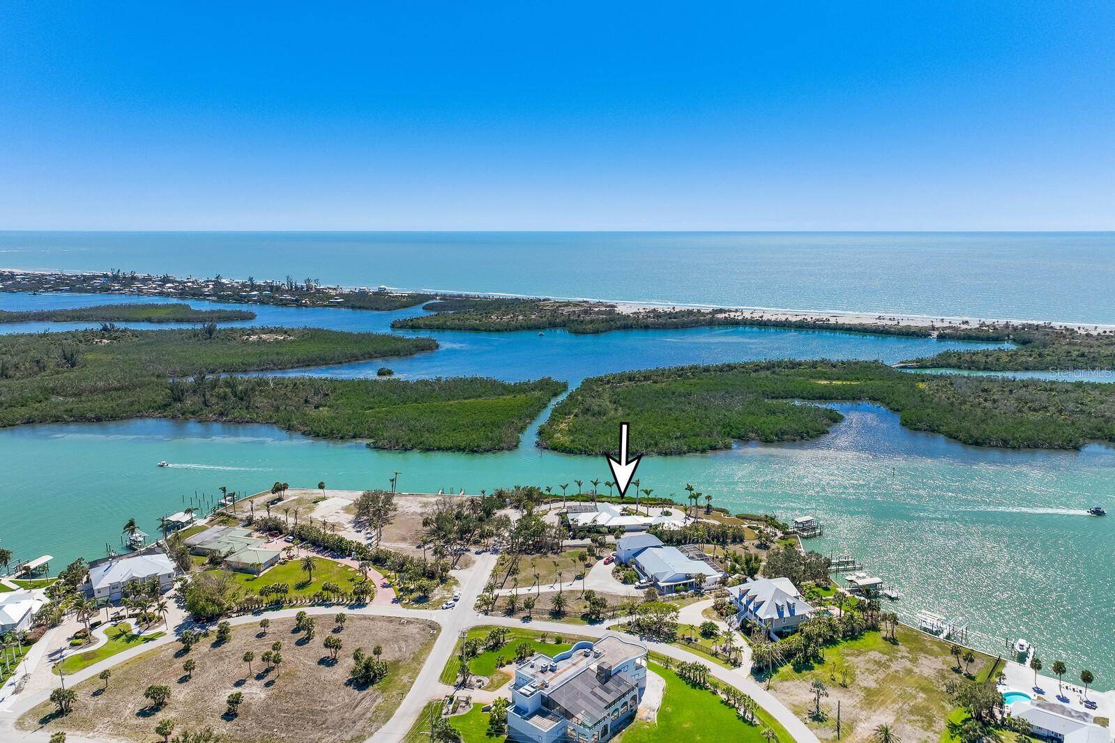 A truly exceptional waterfront opportunity, this 1.23-acre estate commands a prime point position at the end of Cape Haze Drive, where 200-degree panoramic water views frame a backdrop of breathtaking sunsets. Boasting an unparalleled 450 feet of Intracoastal frontage on a no-wake zone, this property is an oasis of privacy and prestige, seamlessly merging luxury, tranquility, and the boundless beauty of the area.
Completely reimagined in 2006 by Curley Custom Homes, this five-bedroom, four-bath residence has been elevated with best-in-class finishes, effortlessly blending timeless architecture with modern refinement. Sunlight dances across open living spaces, where floor-to-ceiling windows showcase the endless water views. The chef’s kitchen is outfitted with state-of-the-art appliances and custom cabinetry, while the spacious primary suite offers a sanctuary of relaxation, complete with a spa-like bath.
Designed for seamless indoor-outdoor living, the residence flows effortlessly onto a screened, waterfront pool deck, where pool enjoys southwestern sun throughout the afternoon. Direct access from the home invites a life centered around sun-drenched leisure and al fresco entertaining.
The deepwater dock is a boater’s dream, featuring two lifts—one for a larger vessel and another for a 23-foot skiff. Here, the legendary waters of Charlotte Harbor and Boca Grande Pass are a short boatride away, offering world-class tarpon fishing, idyllic cruising, and effortless access to the Gulf of Mexico.
Adding to its versatility, a private two-bedroom, one-bath guest wing—built by Curley Custom Homes in 2017—offers an inviting retreat for guests or multigenerational living.
Just minutes away, Boca Grande offers an array of upscale boutiques, fine dining, and vibrant coastal culture. Savor fresh seafood and gourmet cuisine at renowned restaurants, browse chic shops and galleries, or unwind on the area's pristine, white-sand beaches with the Gulf’s turquoise waters stretching endlessly before you. With legendary sport fishing just offshore and an atmosphere of effortless elegance, this coveted destination blends luxury with the natural beauty of Florida’s Gulf Coast.
For those seeking exclusivity beyond the water, the private Coral Creek Club offers an elite golfing experience on a championship course set against breathtaking natural beauty. The Coral Creek Airport and Jet Center, catering to private aviation, ensures seamless access to and from this coastal paradise.
This is more than a home; it’s a legacy waterfront property in one of the most coveted enclaves of Cape Haze. If you’re seeking an unrivaled Intracoastal lifestyle, where expansive views, impeccable design, and unparalleled boating access converge—welcome home.