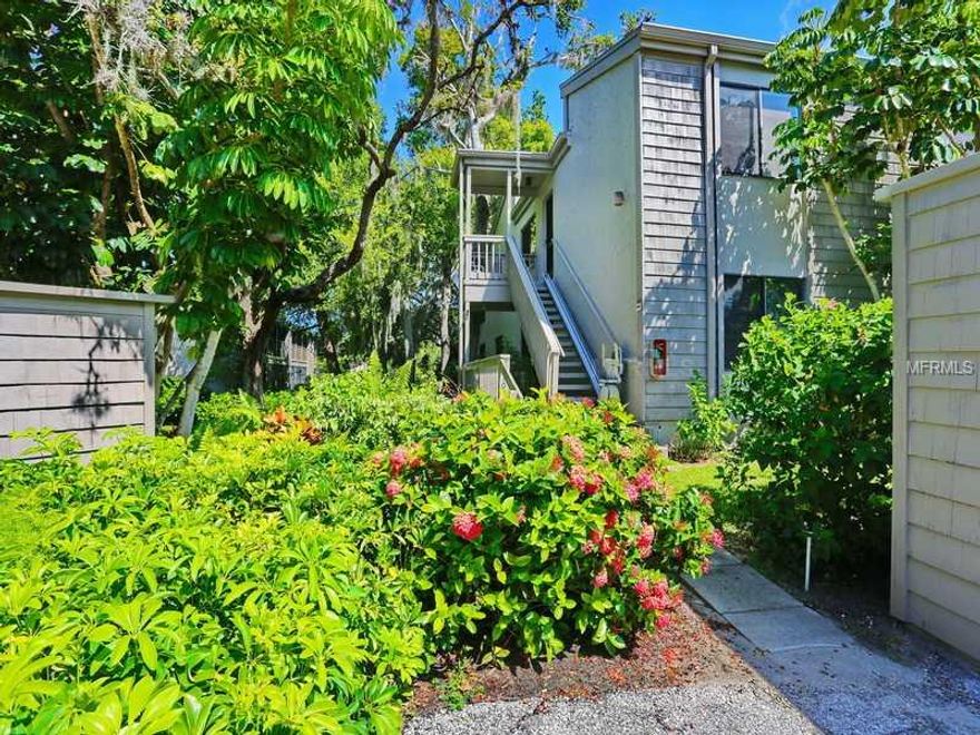 This sunny and airy 3 bedroom, 2 bath condo is located in popular Pelican Cove, a gated community which offers spectacular views of the Intracoastal, 6 pools, an 87-slip boat harbor, 3 clubhouses, walking trails, fishing pier and its own " university" with courses and many clubs.  Located on the second floor, the property features vaulted ceilings and an expansive harbor views. Also, along with lovely neutral colors and an abundance of storage, including an easily accessible attic, the condo has an abundance of light. being an end unit. Special events are featured in the monthly newsletter. This lifestyle could be yours, with its aesthetic botanical setting, cultural aspects and its unparalleled amenities