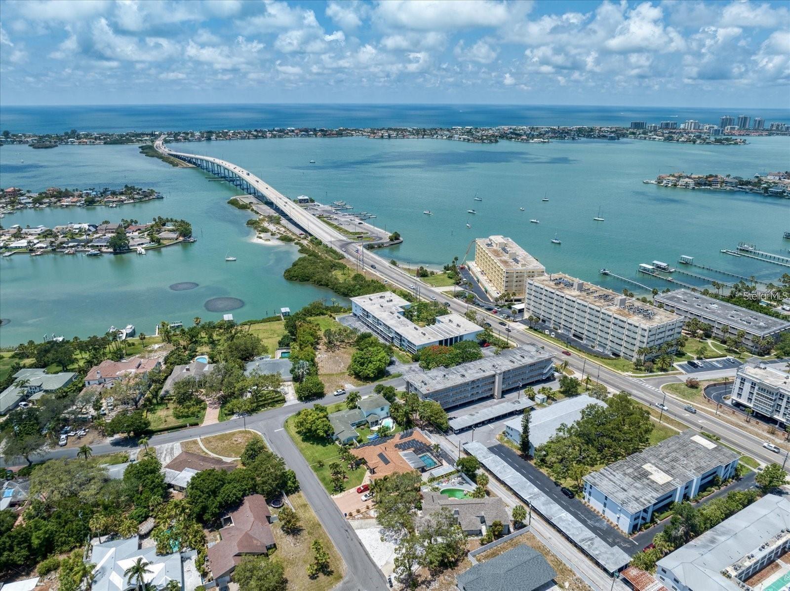 Welcome to this beautiful Rental of 2-bedroom 2-bath condo that hugs the Intracoastal and is also in "NO FLOOD ZONE". All Age community. Just on the corner of the Belleair Beach Bridge. 5 Minutes to the Beach. Covered Assigned parking under the building. Elevators and private storage come with the unit. Completely updated and move-in ready end unit. Welcome to this stunning light and bright corner charmer that is loaded with high end updates. Situated on a high and dry Belleair Bluff this turn-key end unit beauty has been newly renovated. Blessed with all the natural light through the walls of new high impact resistant hurricane windows this home radiates. A gourmet chef's dream kitchen that includes new Quartz counters, shiny stainless steel appliances, decorative backsplash, white Shaker cabinets with soft close doors, new fixtures and the mood/recess lighting has been added. Walk into the oversized great room and notice the luxury new vinyl plank flooring with a rich 5 inch baseboard to compliment. Notice the custom window coverings that dress the new windows, the washer dryer combo that affords you convenience inside your home. Huge walk-in closet in the master with new bath boasting new quartz vanities. The split bedroom floor plan is ideal for privacy and entertaining guests. Having a new water heater, A/c system (2019) , ceiling fans, new plumbing makes this a move in ready gem. The condo also has an under the building parking spot and a storage area for all your beach goodies/toys. Building offers Elevator for your convenience. You are surrounded by luxury and adjacent to some of the most expensive homes in Pinellas County! If you love to walk, run or bike ride you can't beat the location either, just step out the front door and you are on the Belleair Causeway and just a short trip to the sparkling water and white sandy beaches of Belleair Shores! The unit also offers one covered assigned parking space with a large 10x4 storage closet just behind! Perfect for overflow storage or your bikes and beach gear!